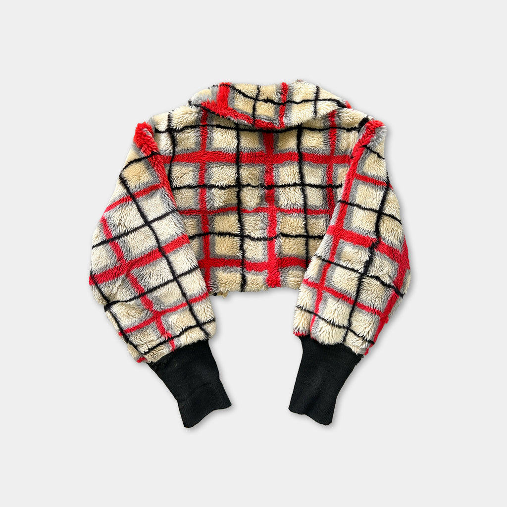 A red and black plaid jacket with a high collar and long sleeves, displayed against a plain background.