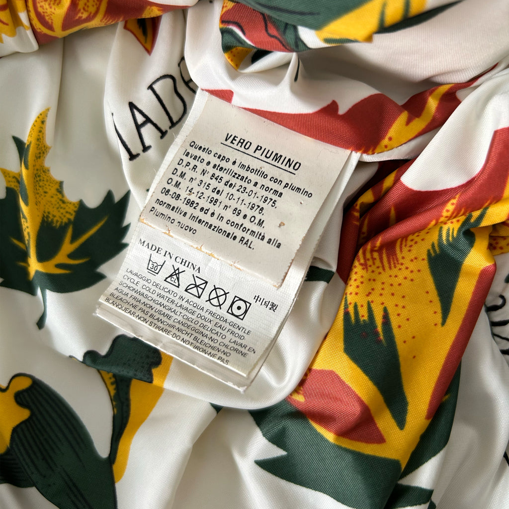 a close-up view of a fabric label with text and symbols, likely providing information about the product.