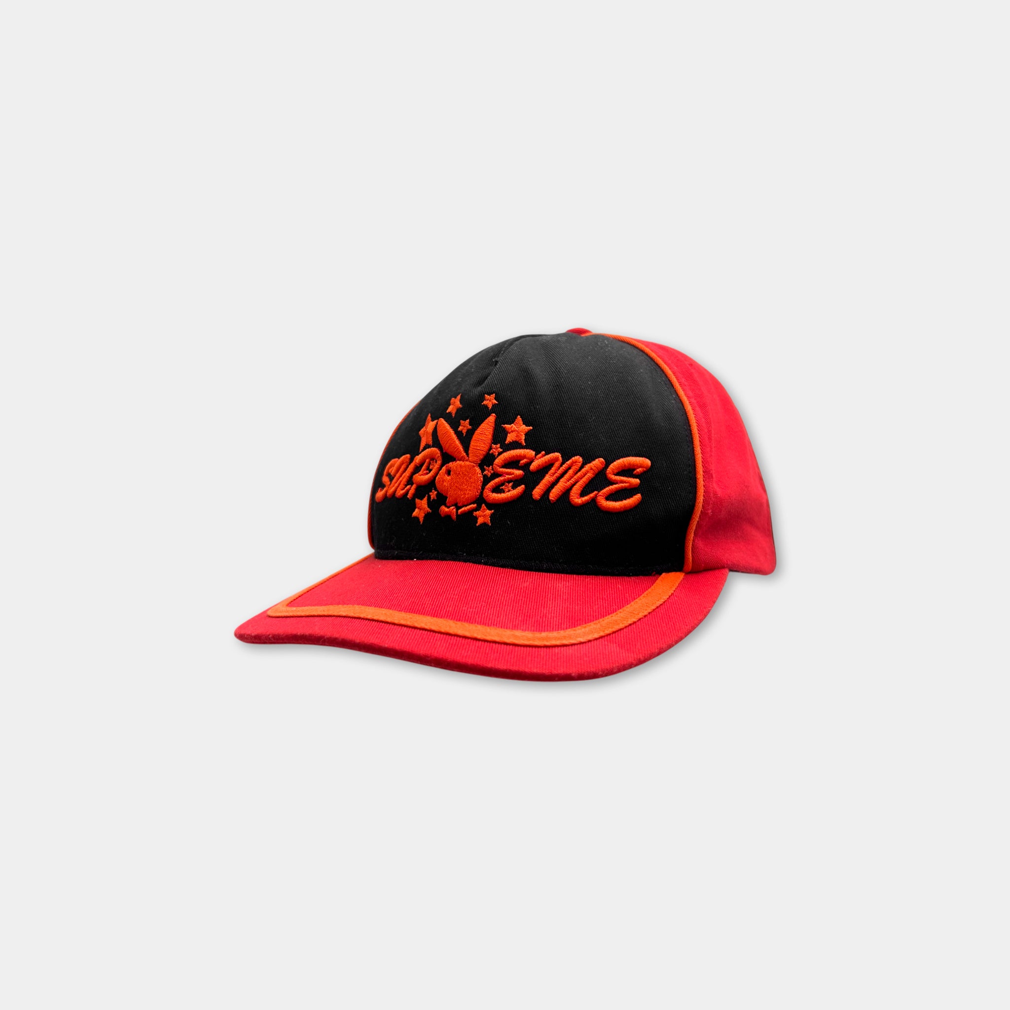 A red and black baseball cap with the word "SAPPHIRE" printed on it.