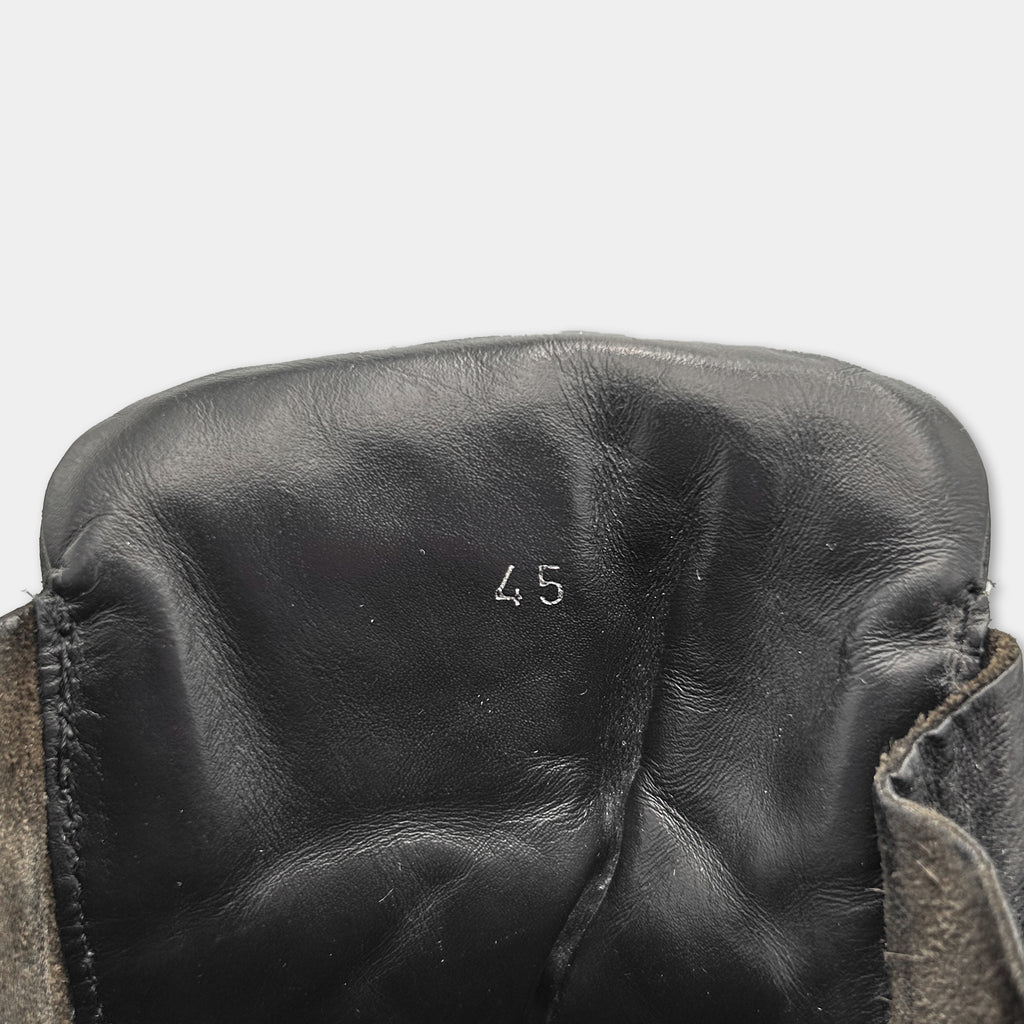 A close-up view of a black leather shoe sole, with the number "45" printed on it.