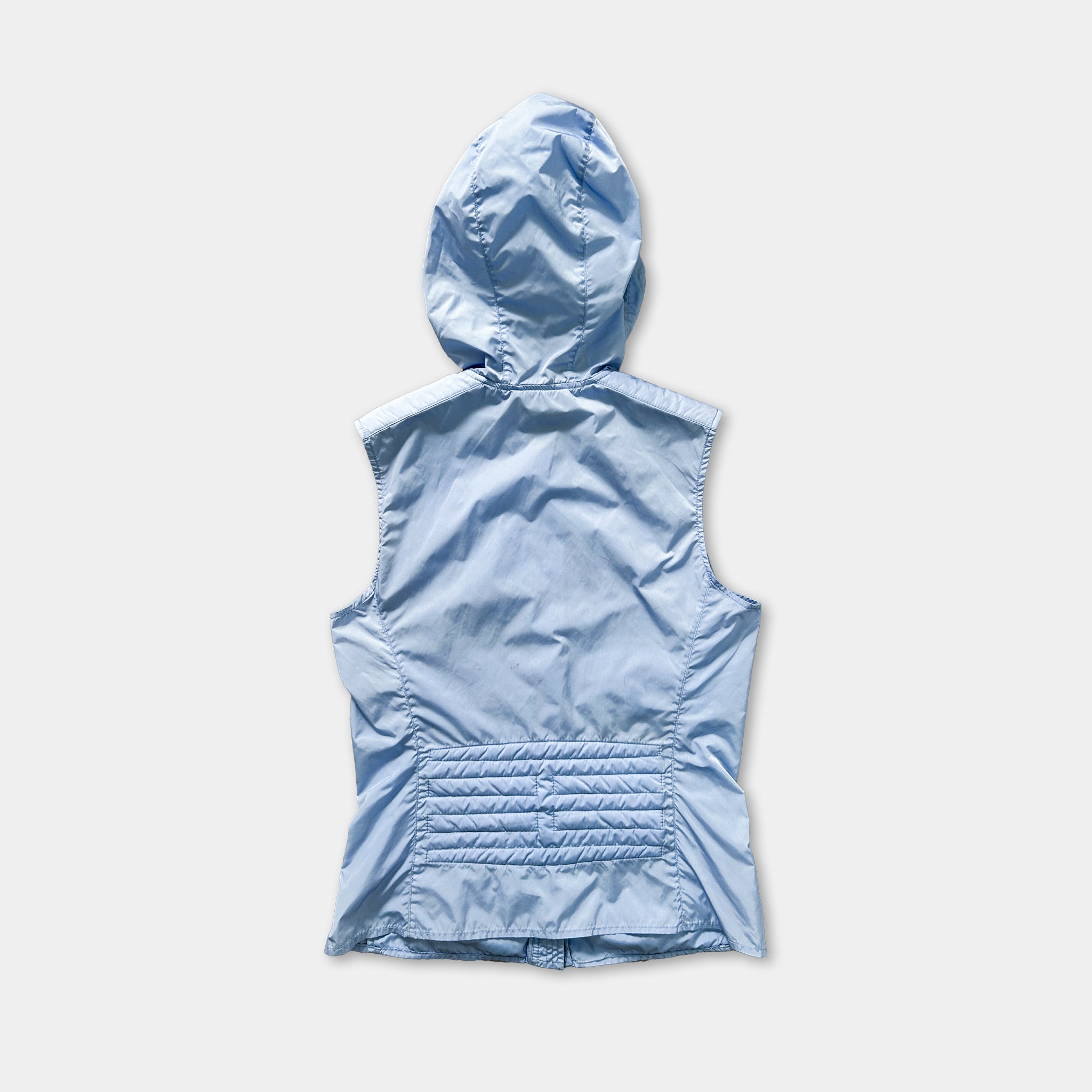 A light blue hooded vest with a hood, displayed against a plain white background.