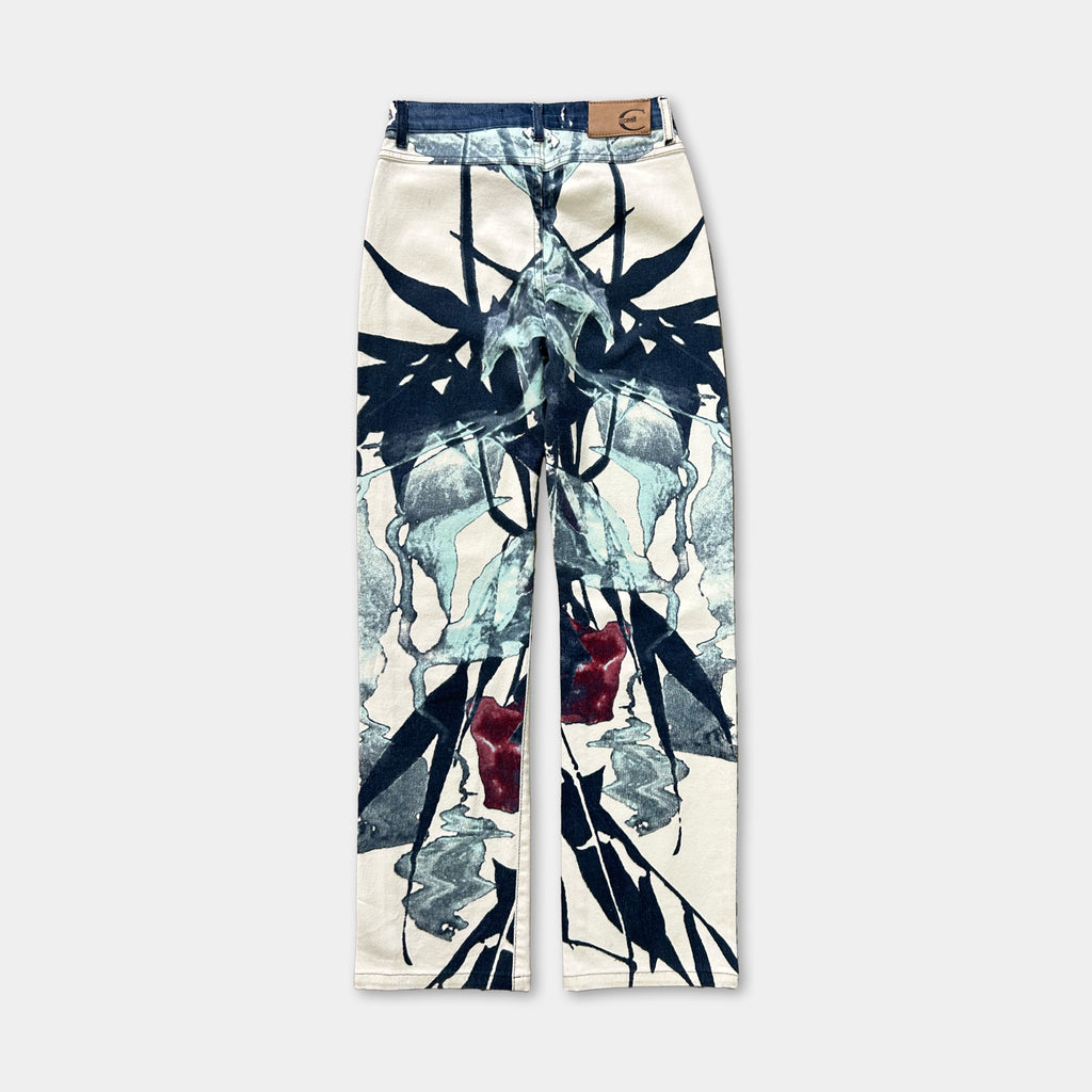 A pair of white pants with a black and white floral print design.