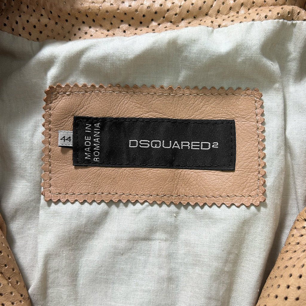 a close-up view of a label on a piece of clothing, likely a jacket or coat, with a label that reads "DQSQUARED2" and "MADE IN ROMANIA".