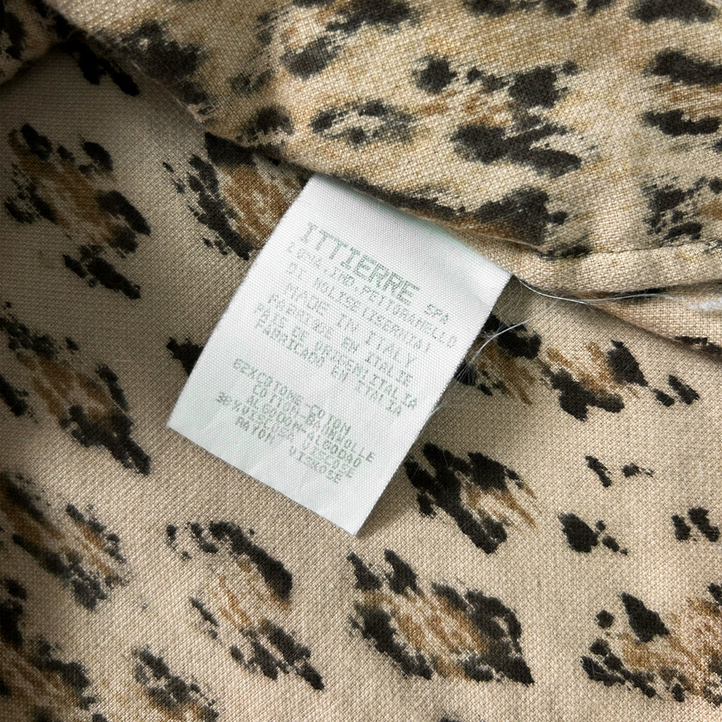a close-up view of a fabric label with a leopard print pattern.