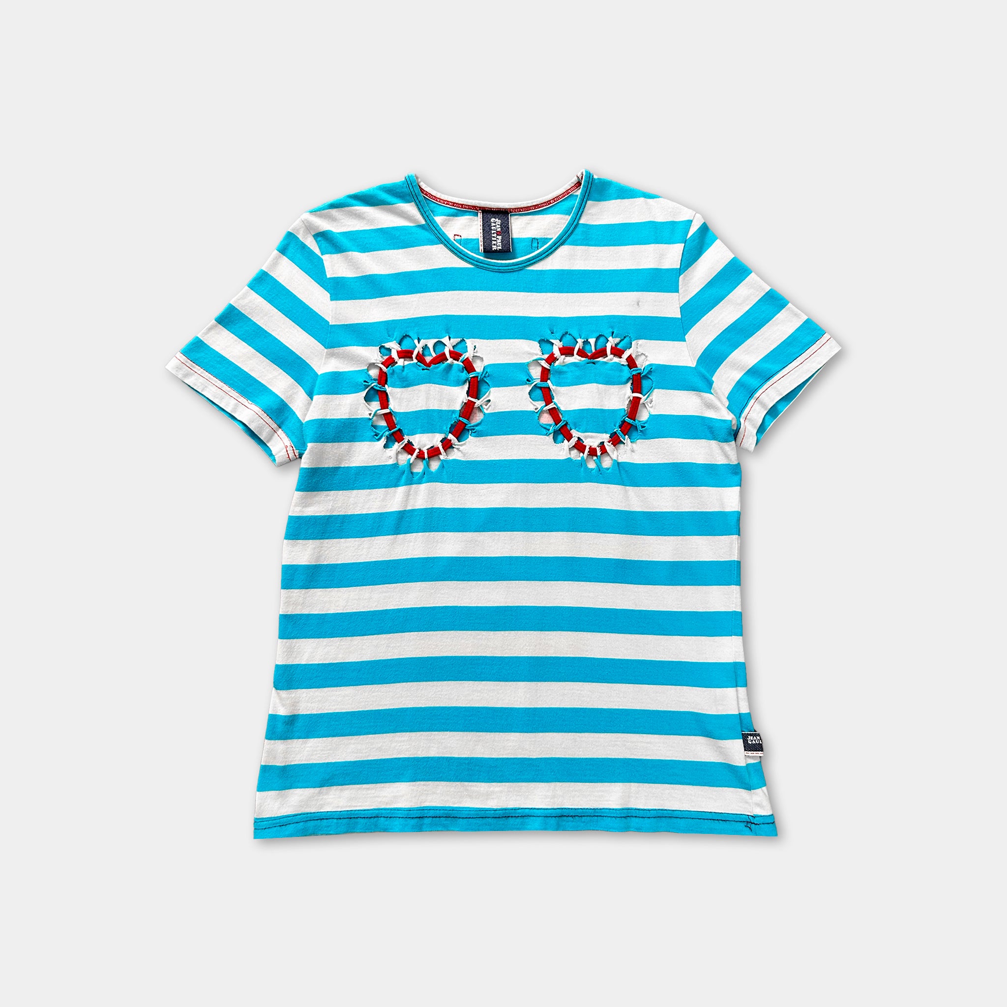 A blue and white striped t-shirt with heart-shaped embellishments on the chest area.