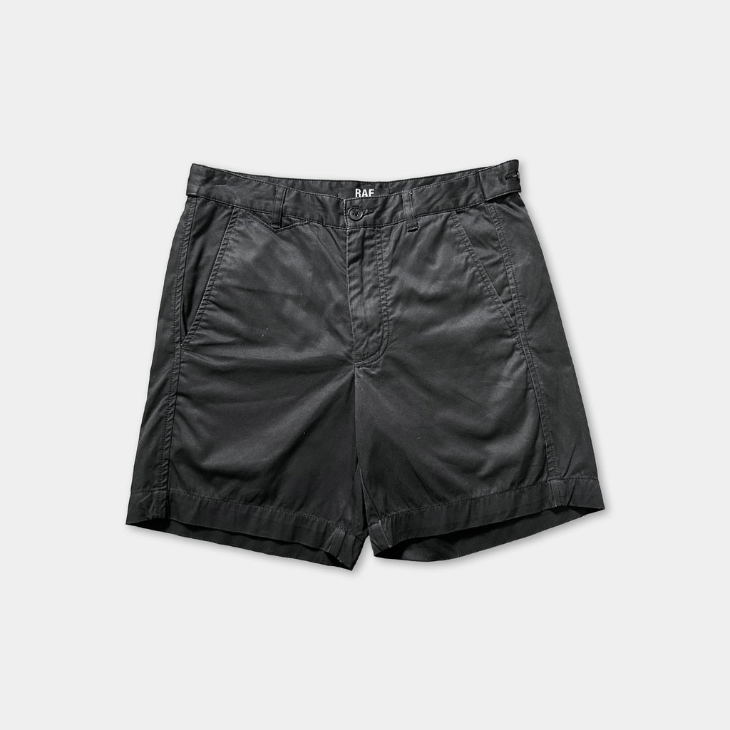 A pair of black shorts against a white background.