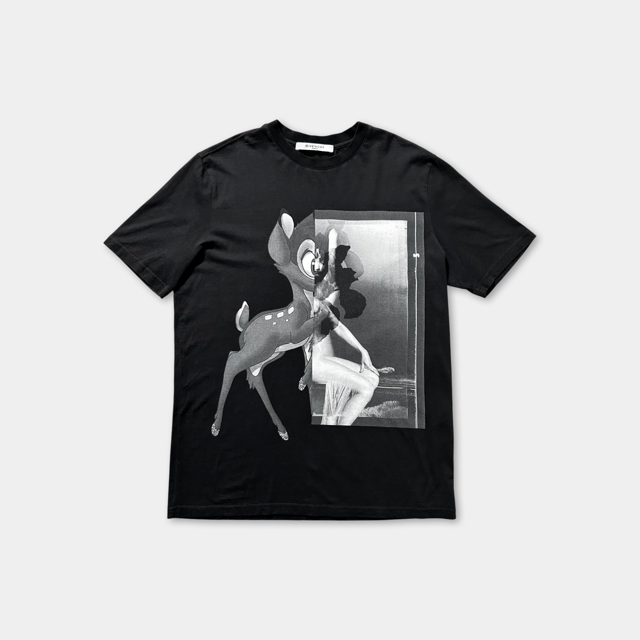 The image is a black and white t-shirt with a graphic design featuring a deer and a woman.
