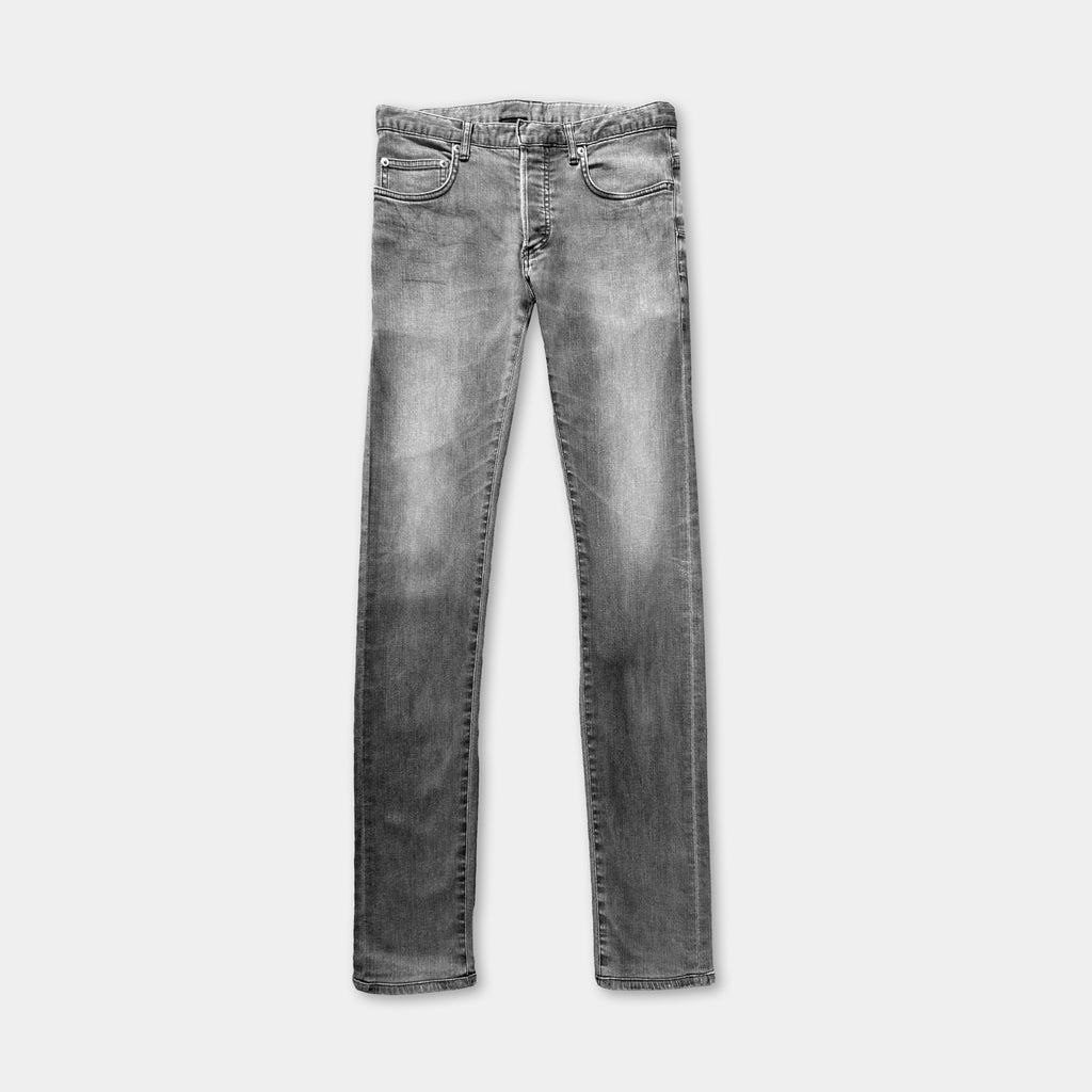 A pair of gray skinny jeans with a classic fit and a button closure.