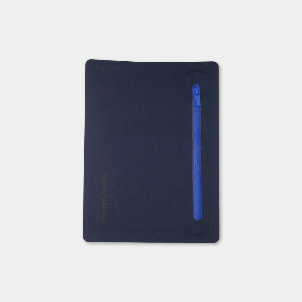 A dark blue object with a blue zipper on the right side.