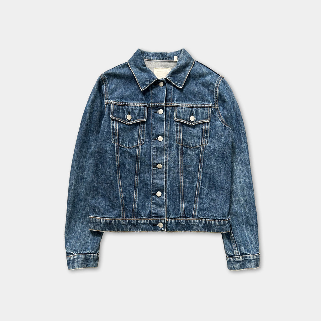 A denim jacket with a button-down front and long sleeves, displayed against a plain background.