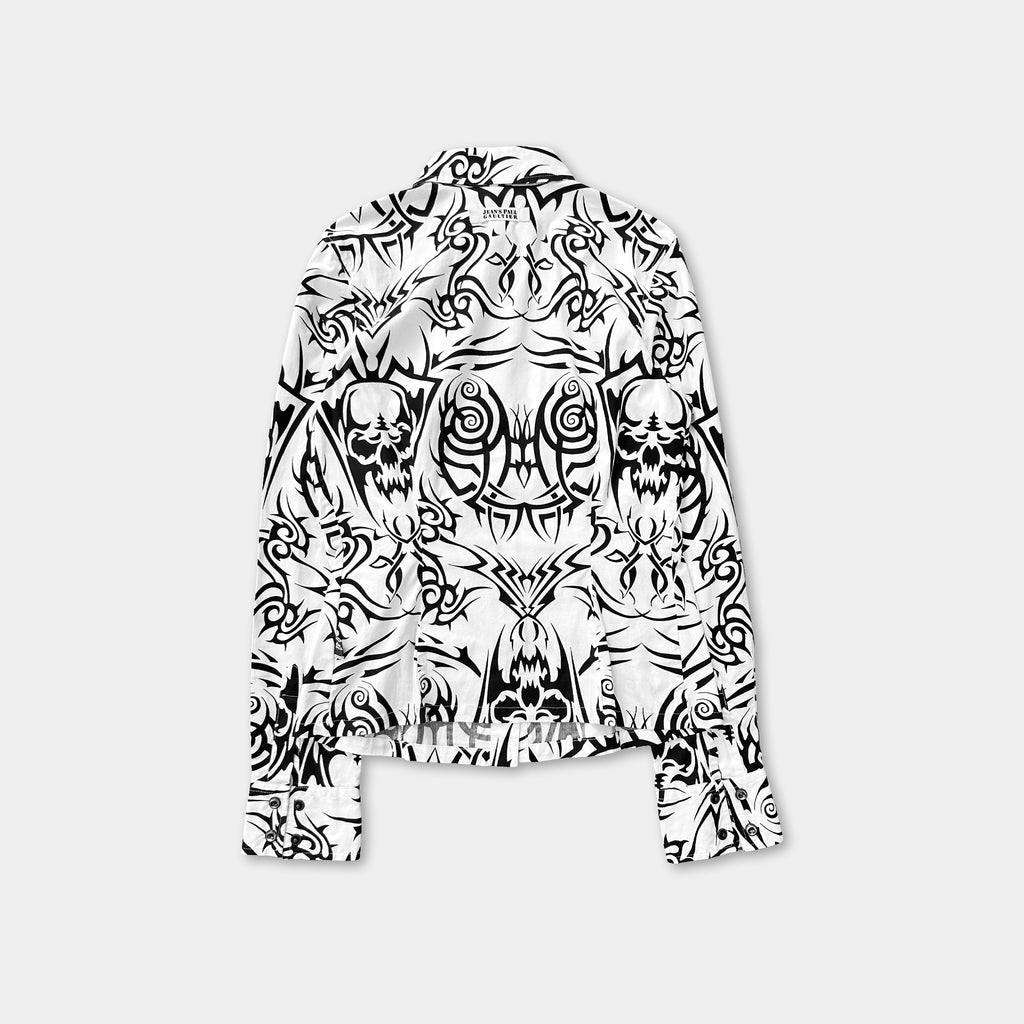 a black and white patterned shirt with a skull and crossbones design.