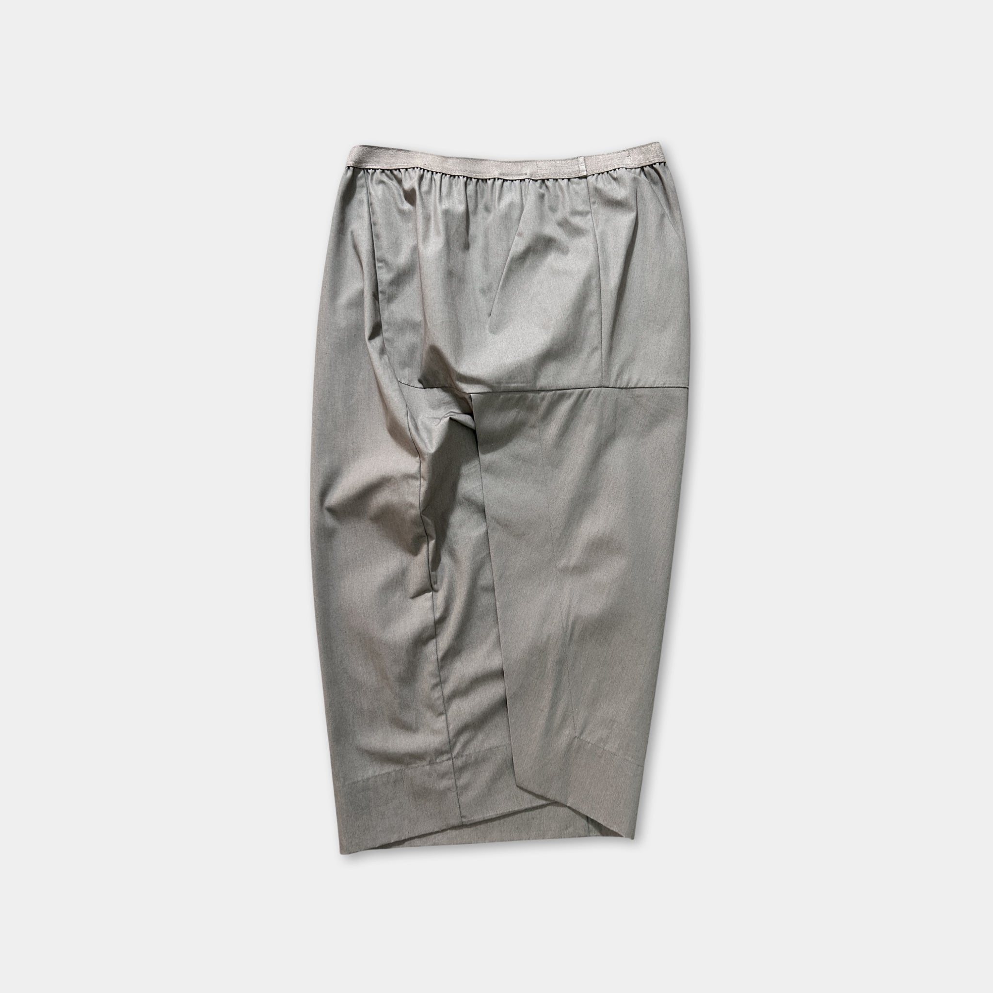 A gray skirt with a ruffled waistband is shown against a plain background.