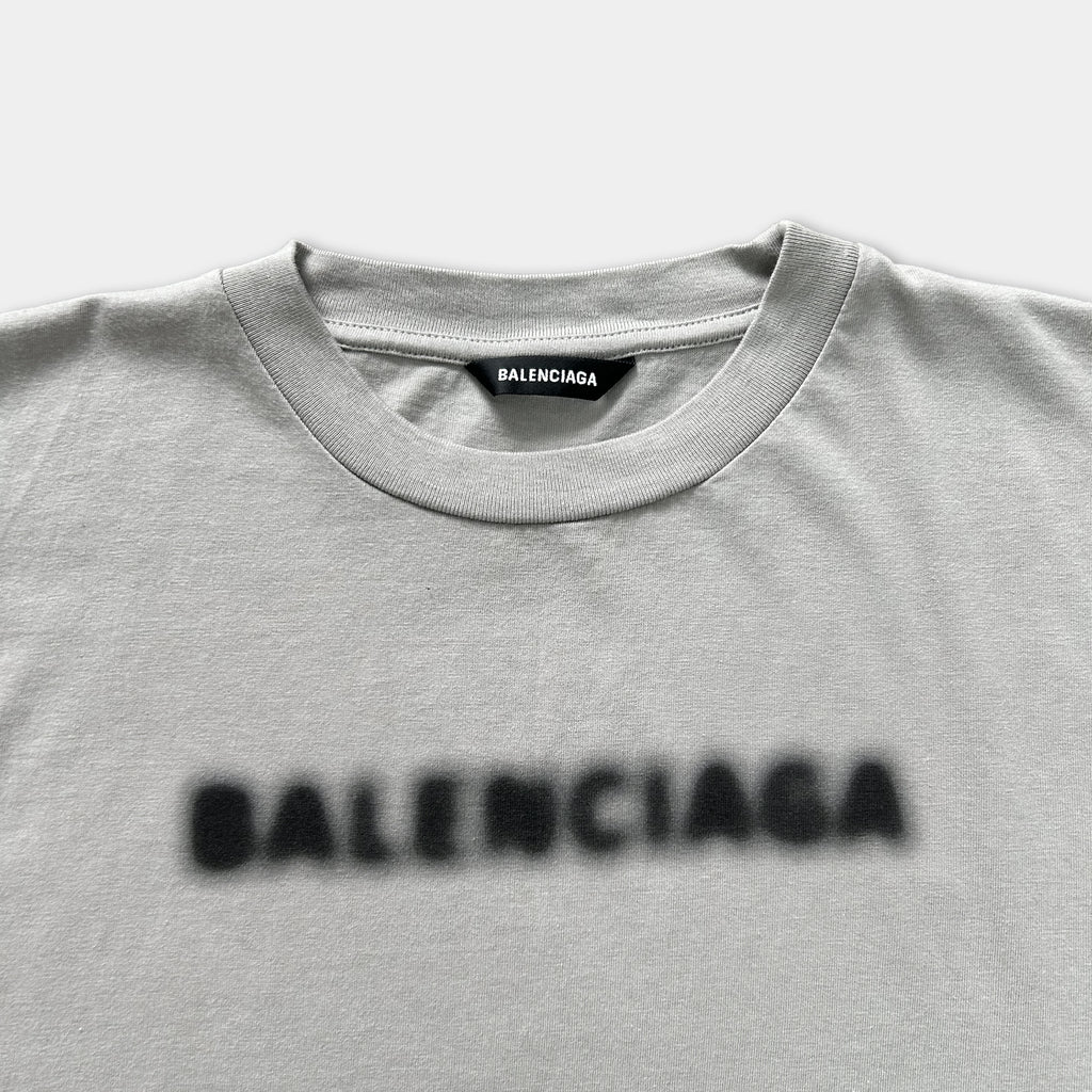 A gray t-shirt with the word "BALENCIA" printed on it.