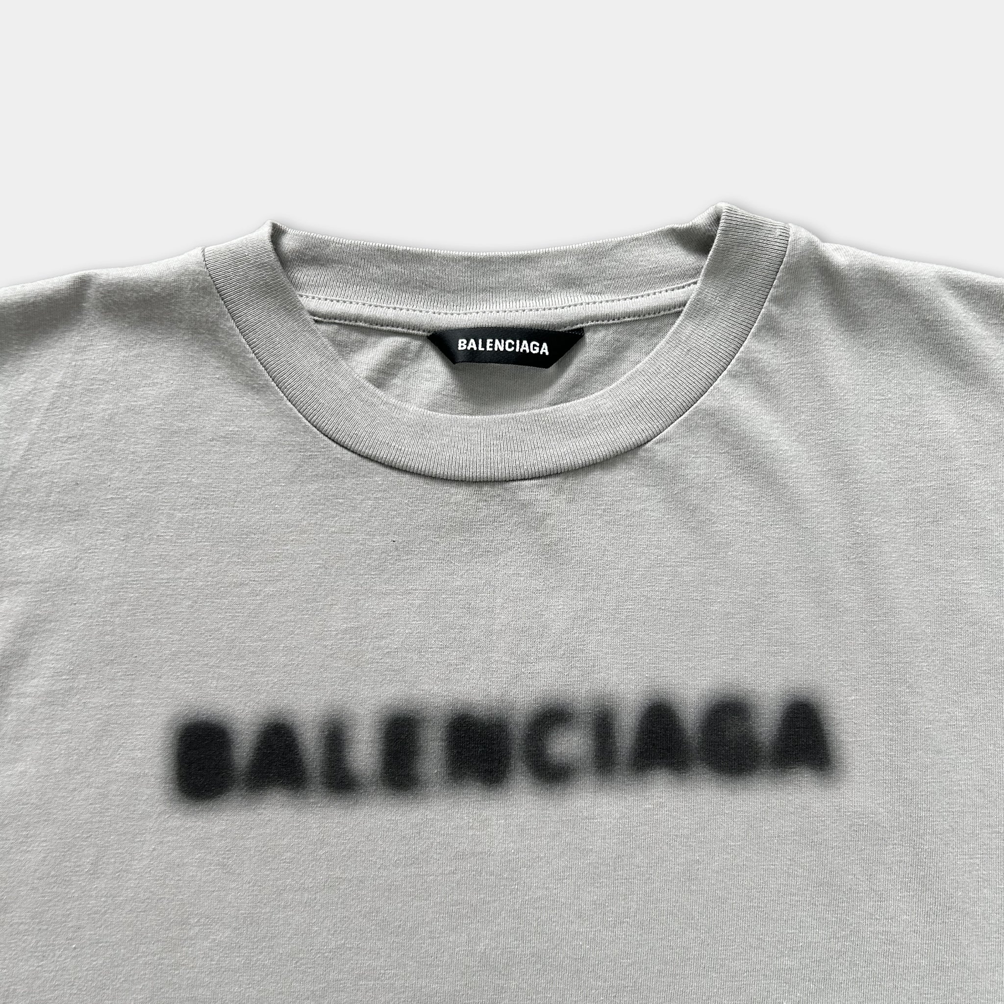 A gray t-shirt with the word "BALENCIA" printed on it.
