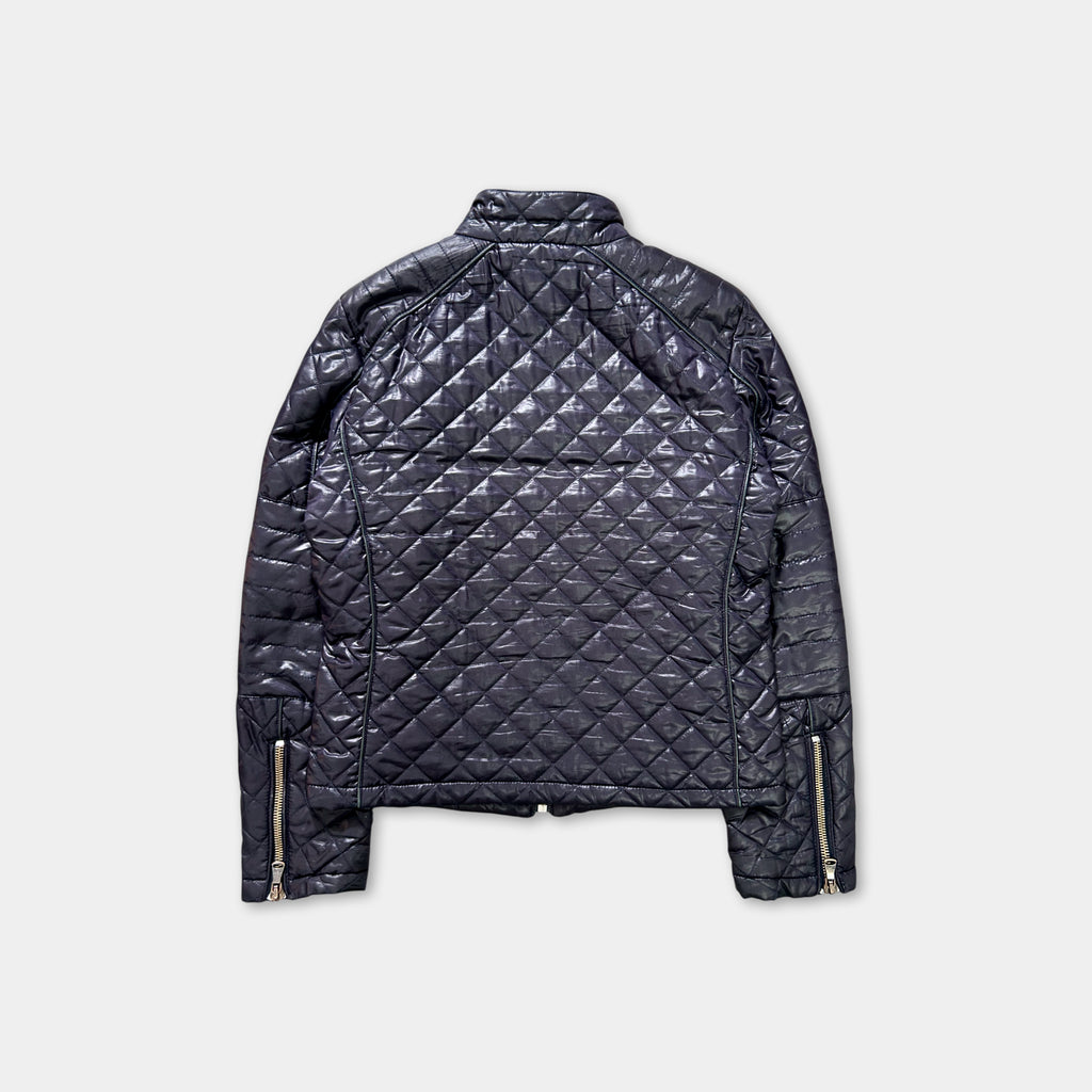 A black quilted jacket with zippers and a collar, displayed against a white background.