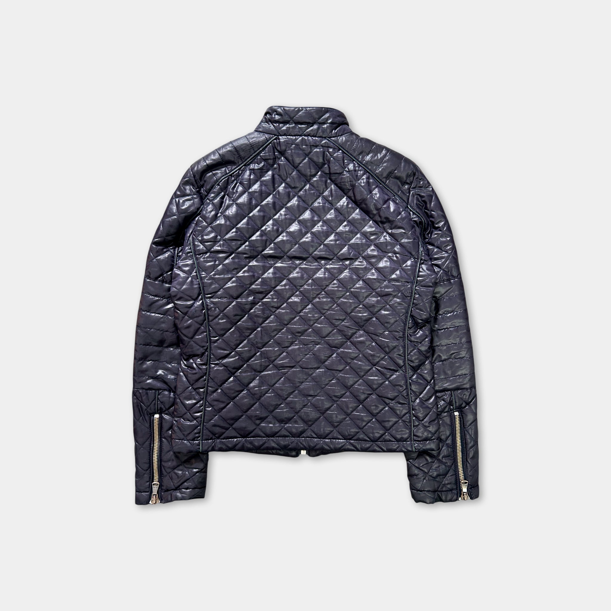A black quilted jacket with zippers and a collar, displayed against a white background.