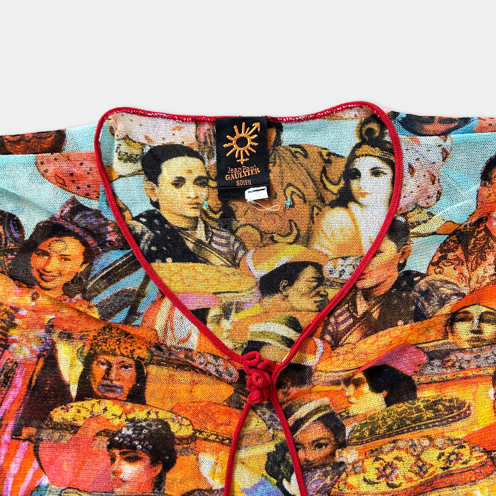 The image is a colorful collage of various people, including both men and women, with a red ribbon tied around the center of the collage.