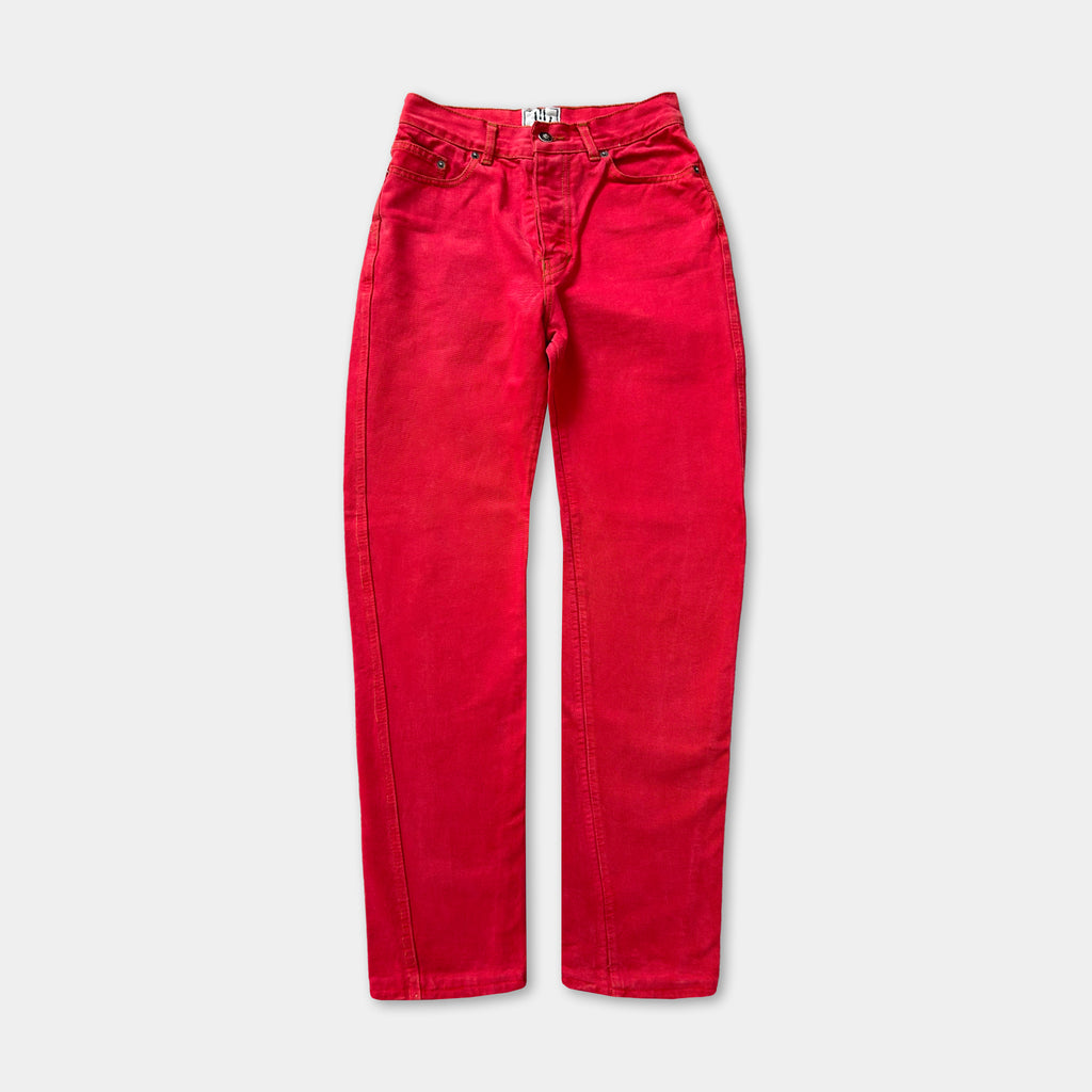 A pair of bright red jeans with a high-waisted design.
