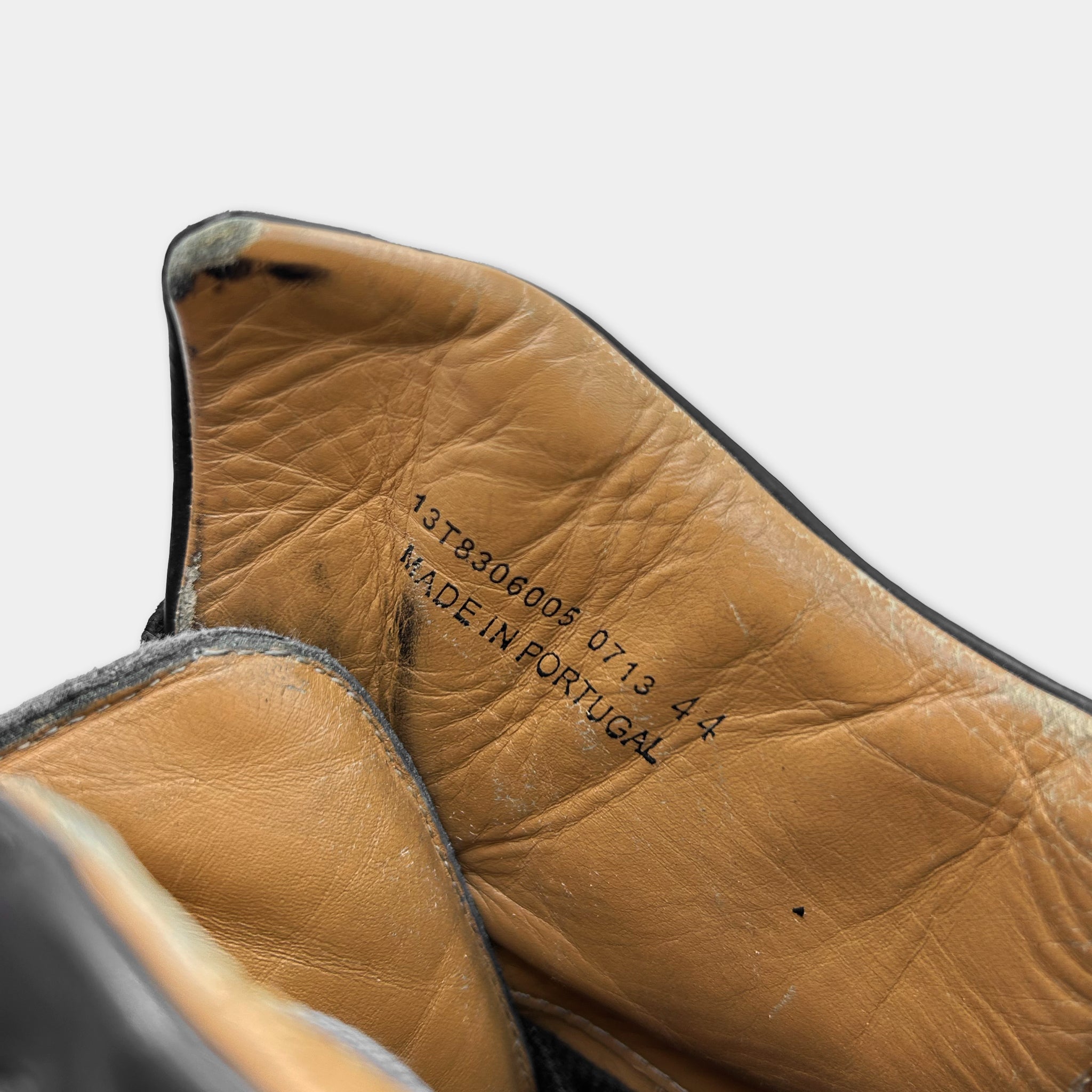 the inside of a shoe, specifically the sole and the leather material. There is a label or text printed on the leather that reads "1378300005 0713 44 MADE IN FRANCE".