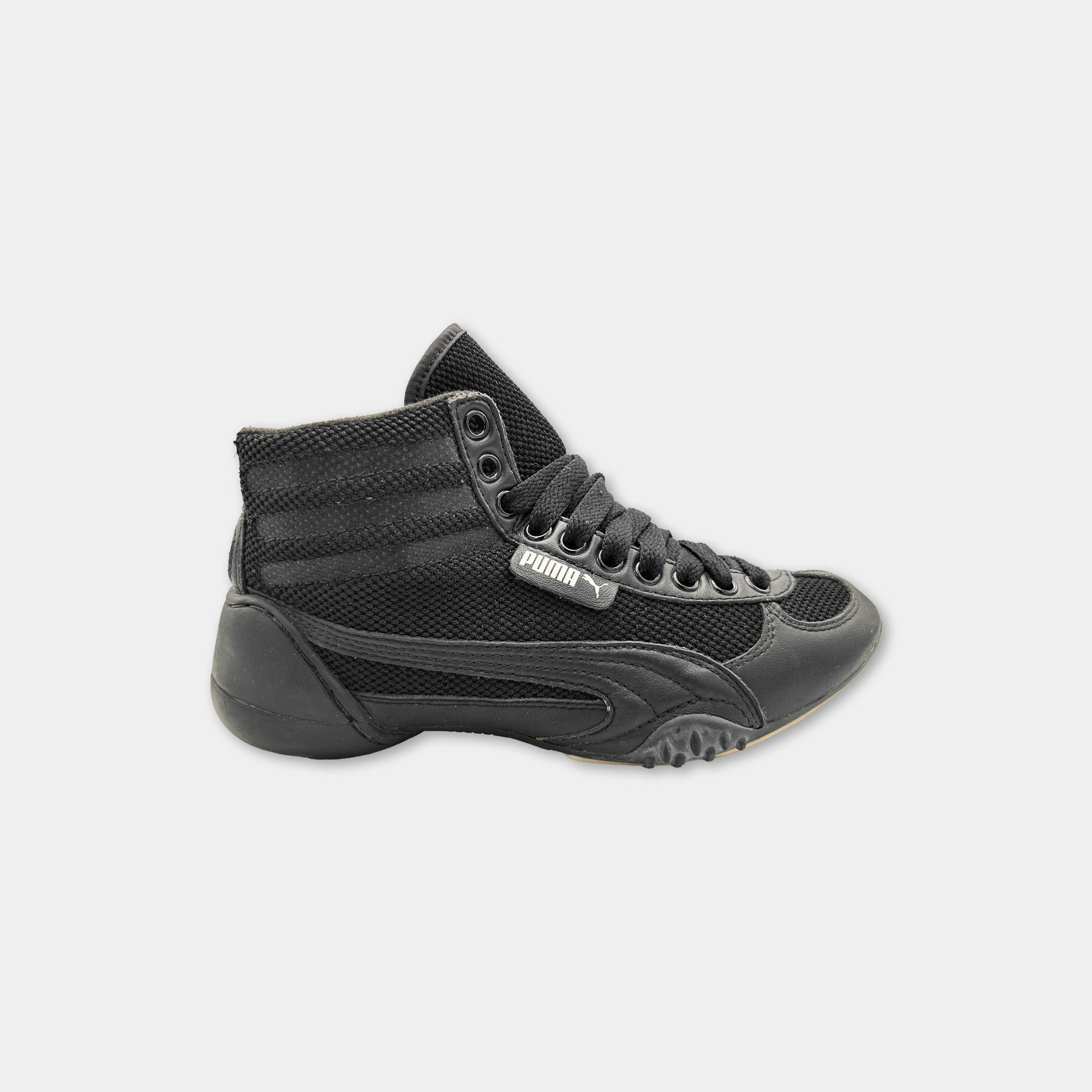 A black and gray sneaker with a mesh upper and laces.
