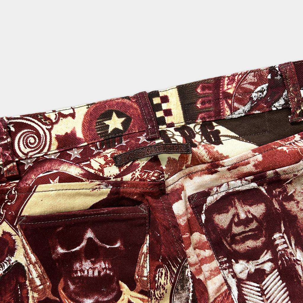 a close-up view of a pair of pants with a vibrant, printed design featuring a skull, a star, and various other patterns.