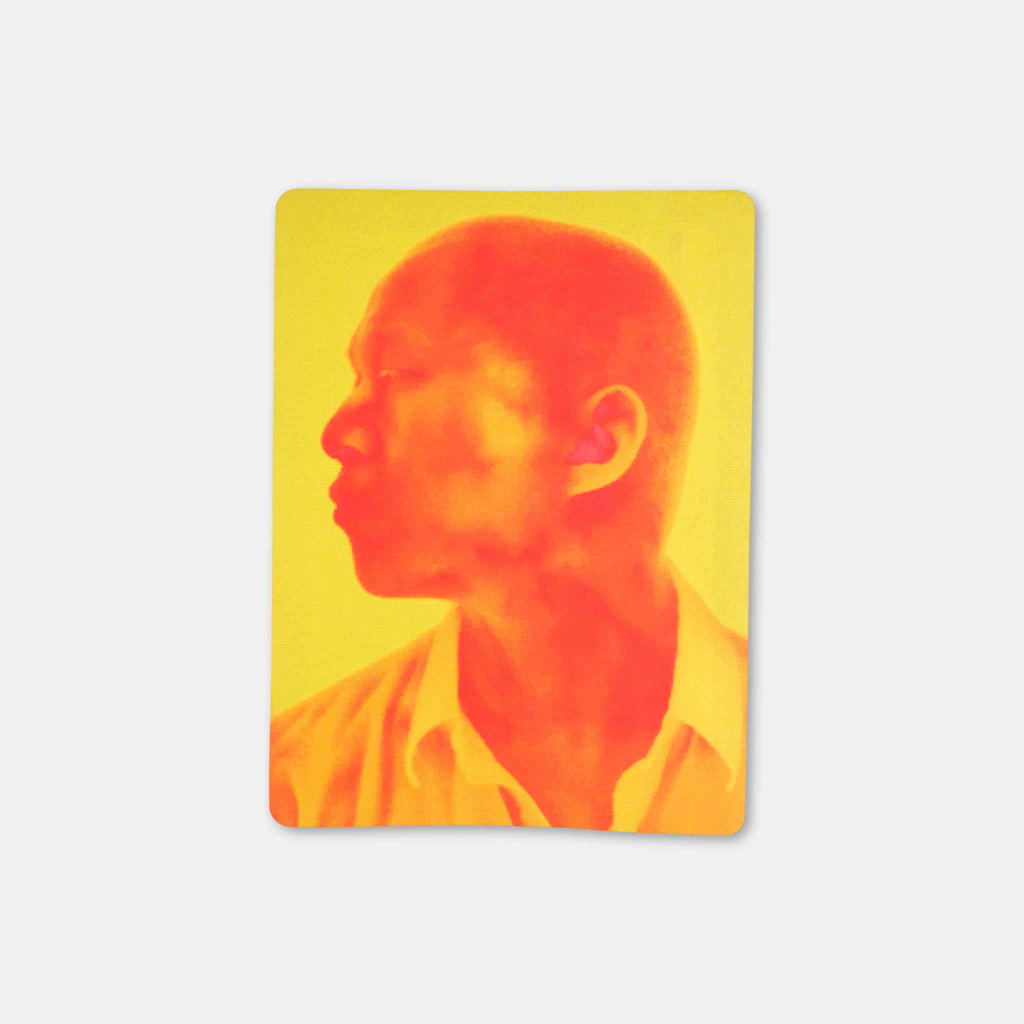A close-up of a person's face in profile against a bright yellow background.