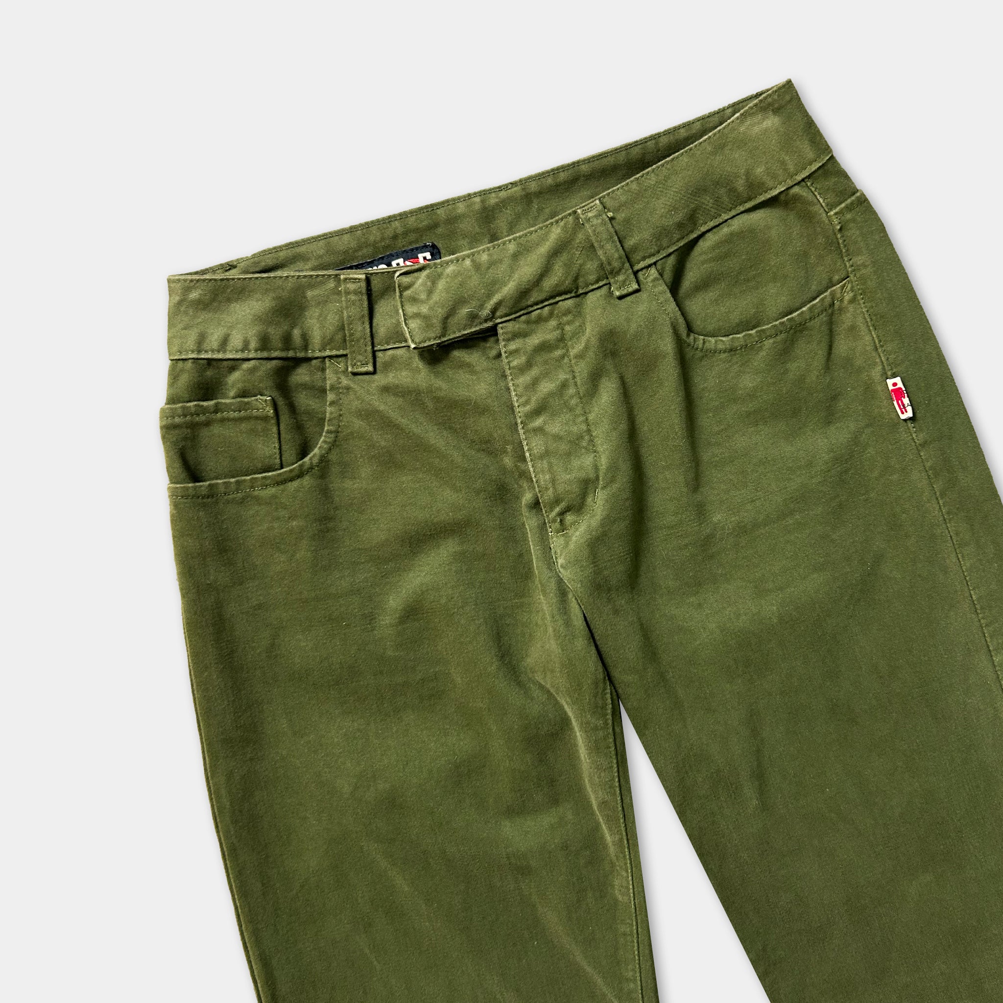 A pair of olive green cargo pants with a black belt and a small red tag on the waistband.