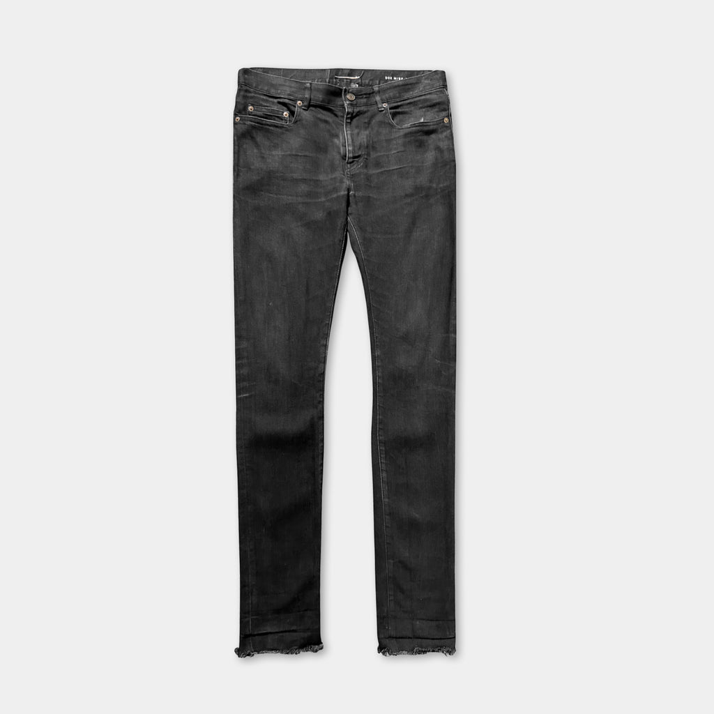 A pair of black skinny jeans with a dark wash.