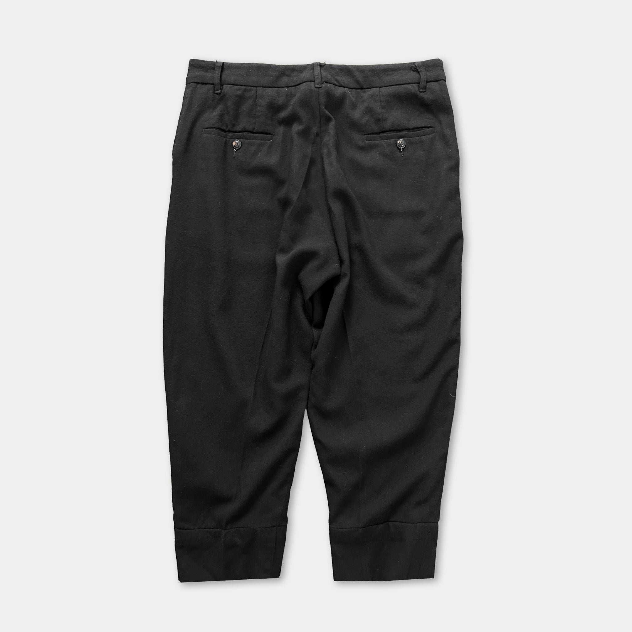 a pair of black trousers with a button waistband and two pockets.