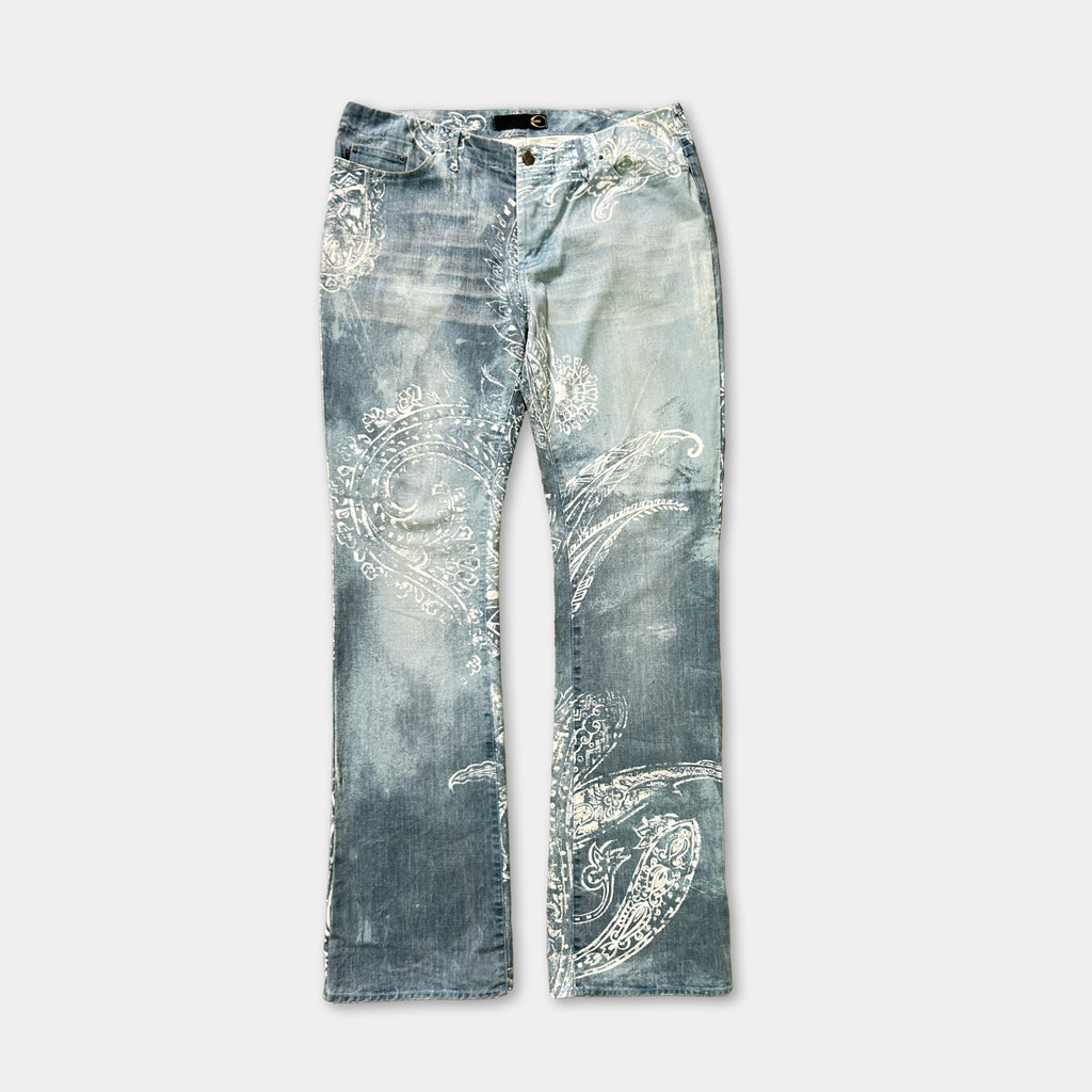 A pair of blue jeans with a paisley pattern design.