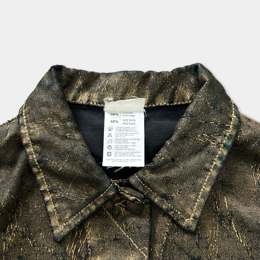 a close-up view of a collar and a label attached to a piece of clothing, likely a jacket or blazer.