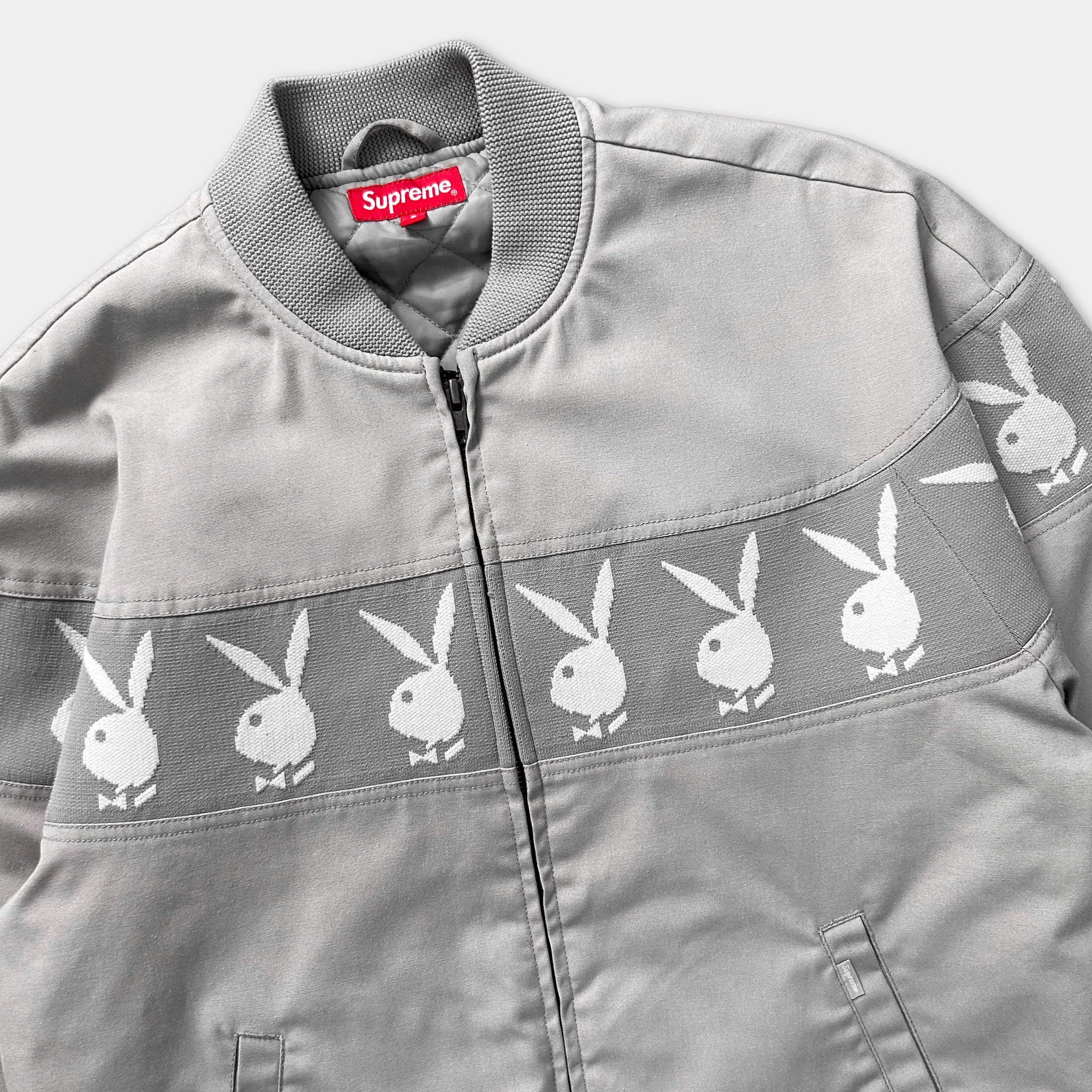 A gray jacket with a repeating pattern of white bunny images on the front.