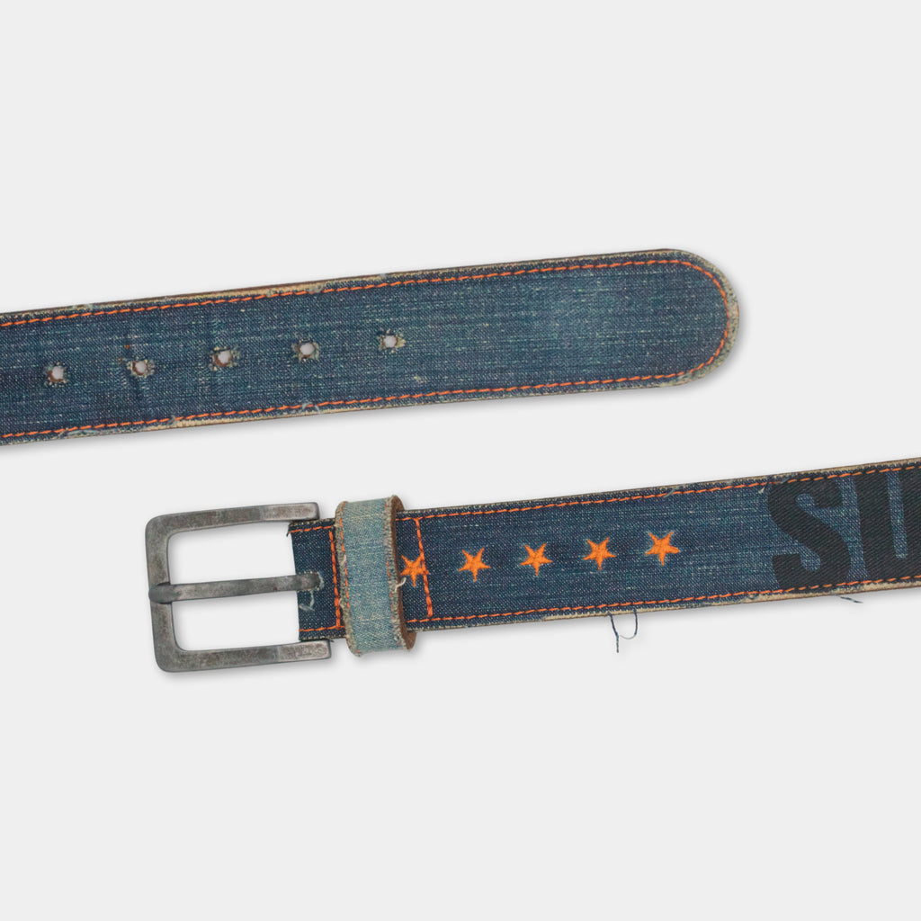 a pair of blue denim belts with orange star patterns on them.