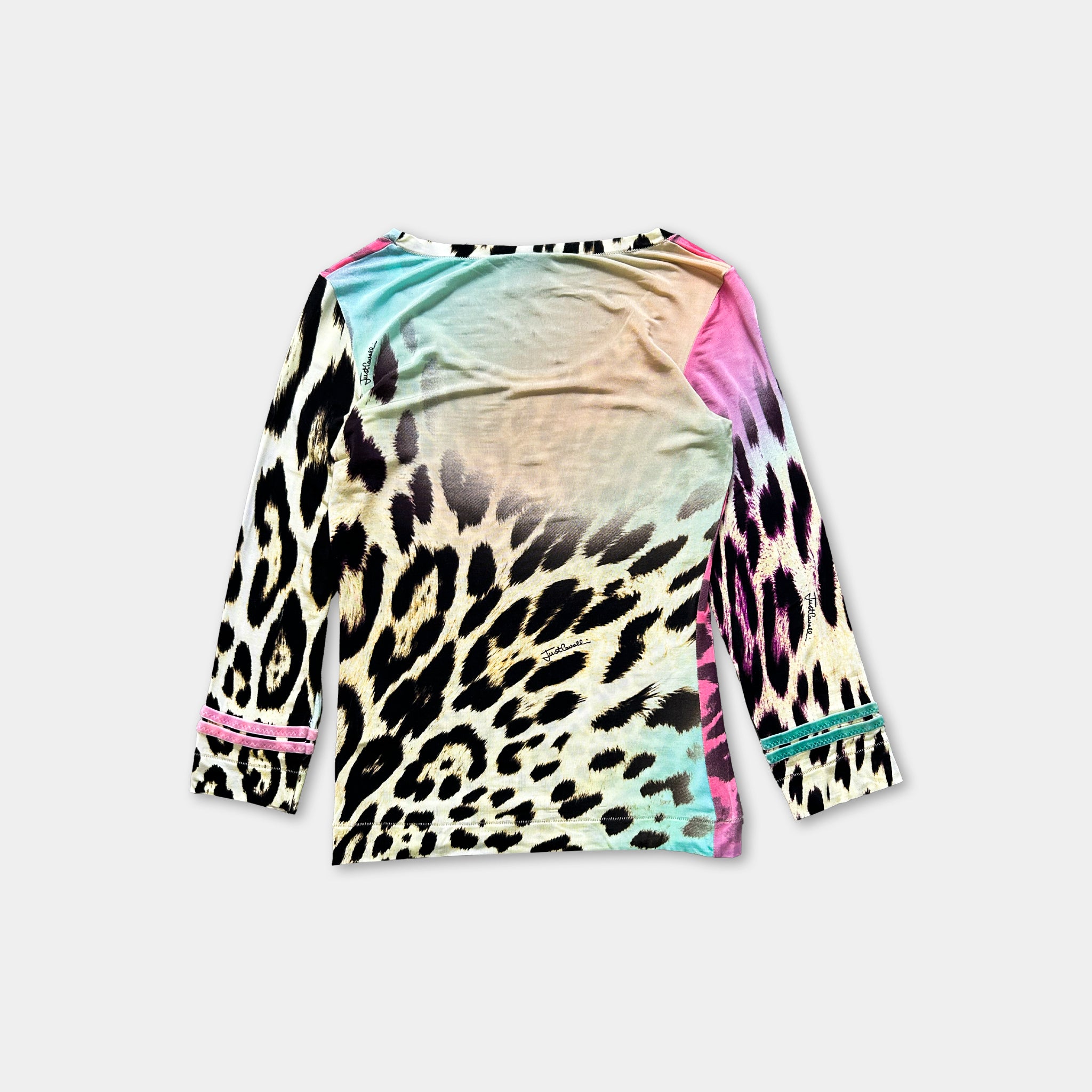 A colorful, patterned long-sleeved shirt with a leopard print design.