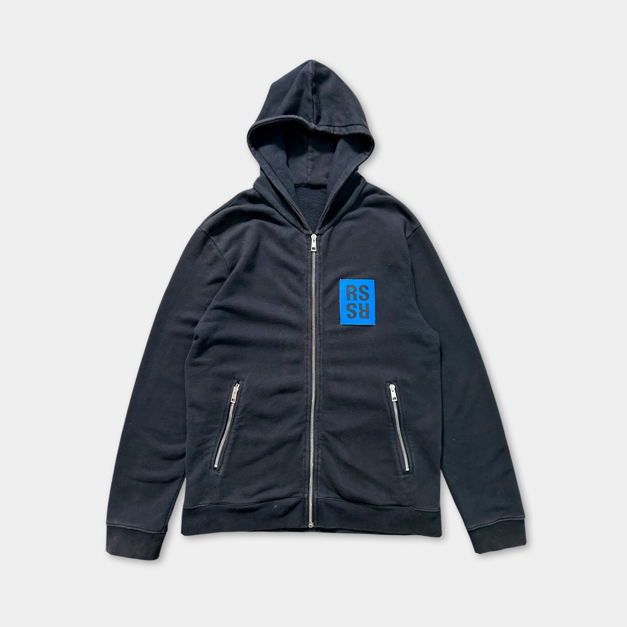 A black zip-up hoodie with a blue square logo on the left side.