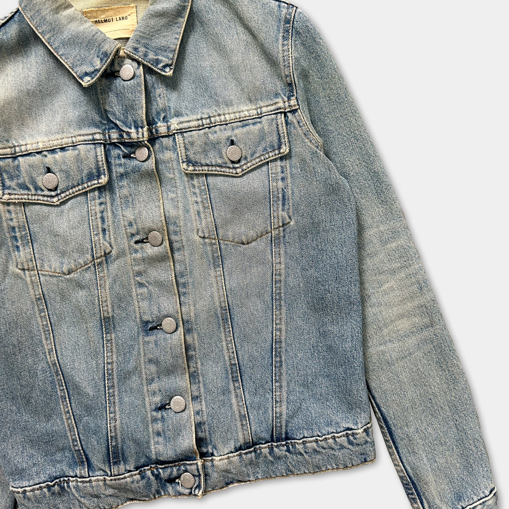 A denim jacket with a button-down front and two pockets, displayed against a plain background.