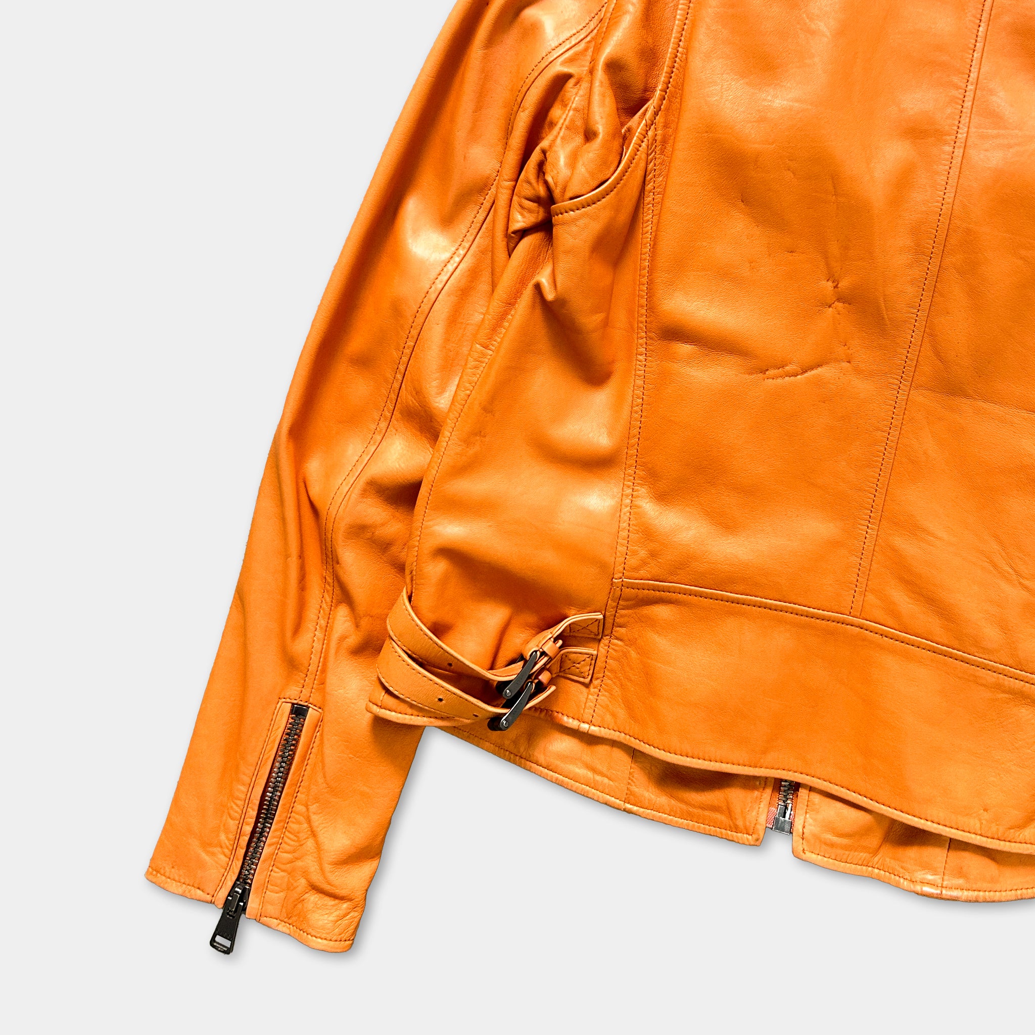 A bright orange leather jacket with a zipper and belt detail.