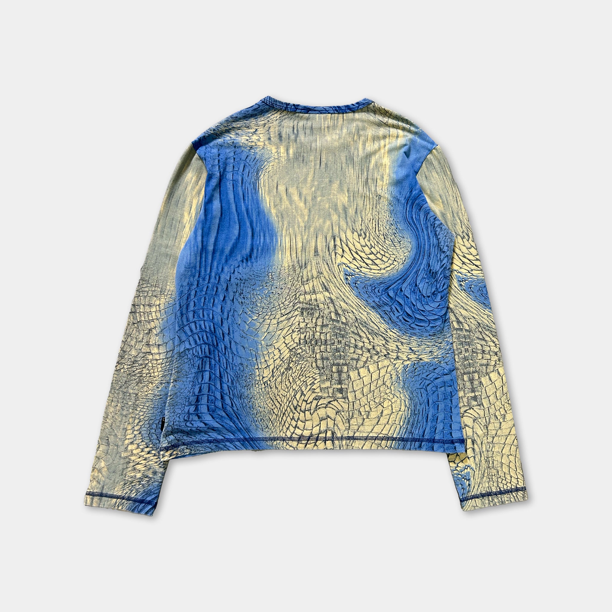 a long-sleeved shirt with a blue and yellow patterned design.