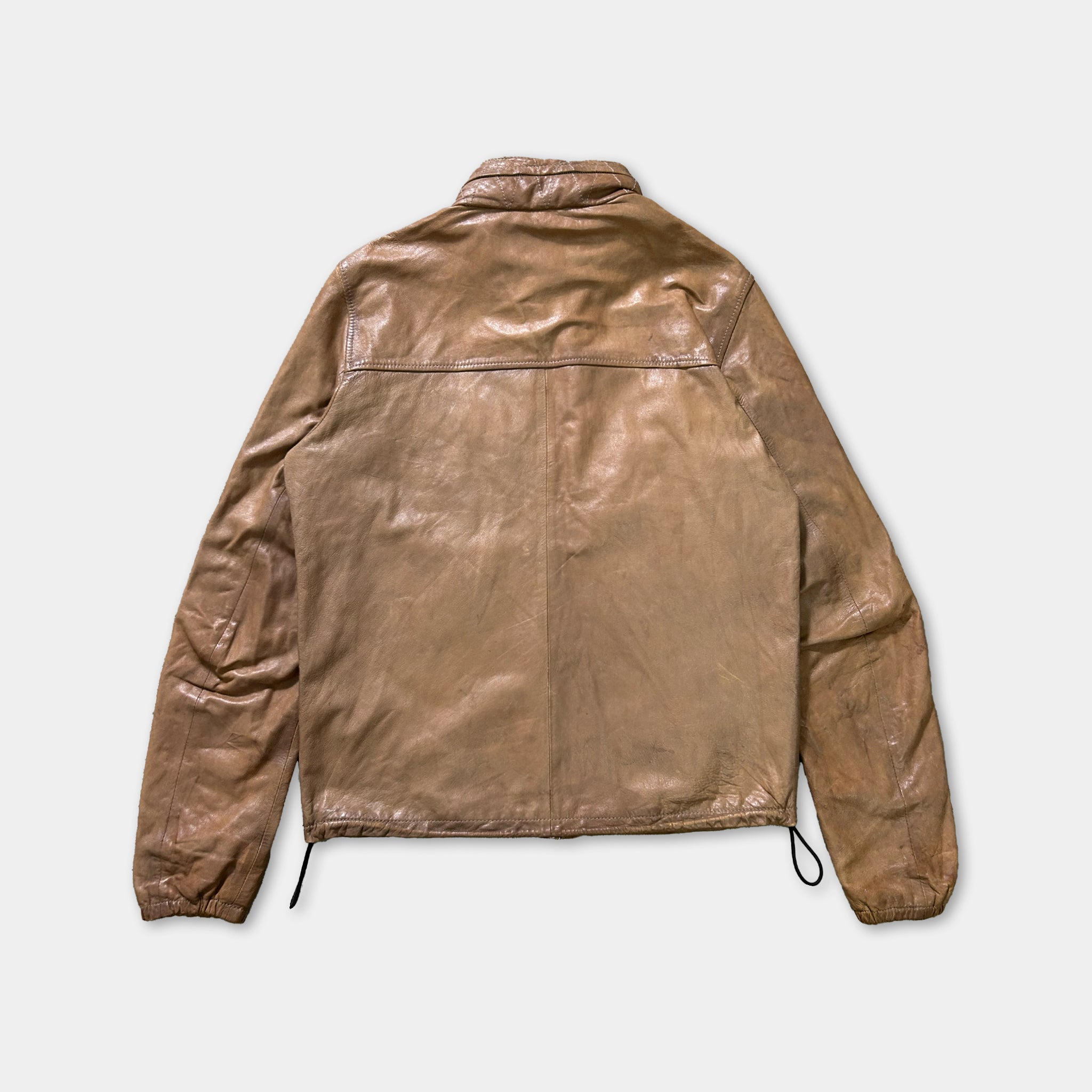 A brown leather jacket with a collar and zipper, displayed against a white background.