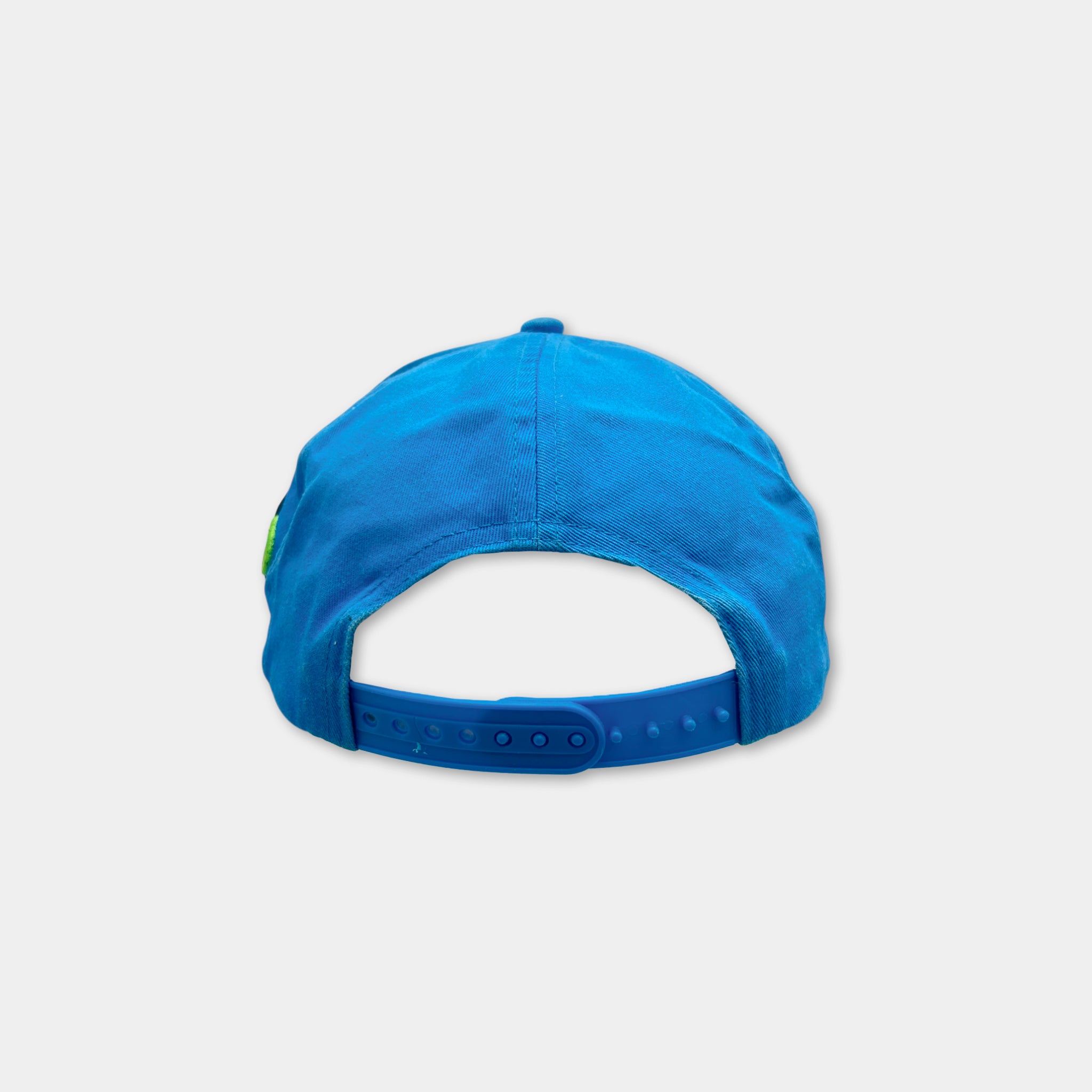 A blue baseball cap with a green logo on the front.