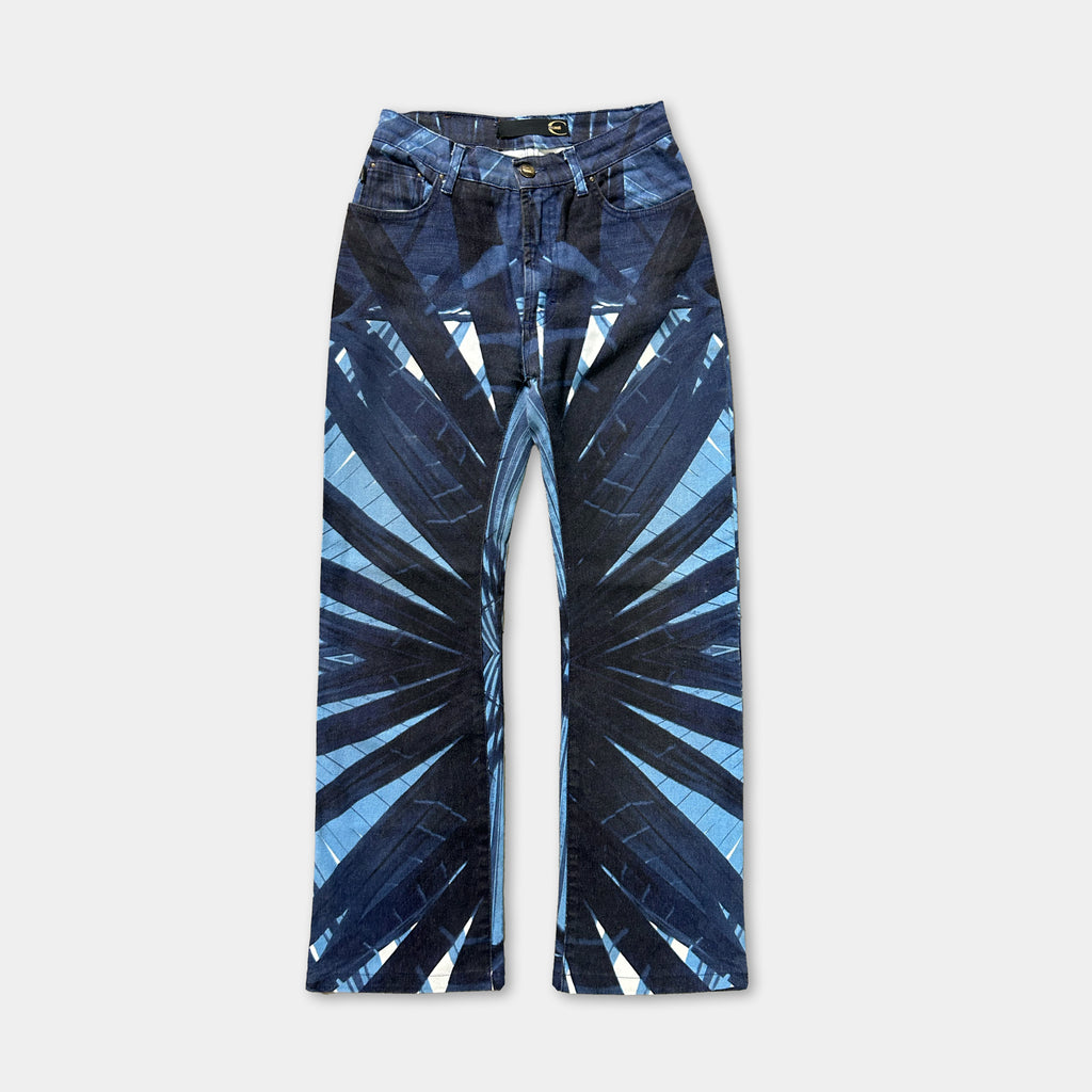 A pair of blue jeans with a tie-dye pattern on the front.