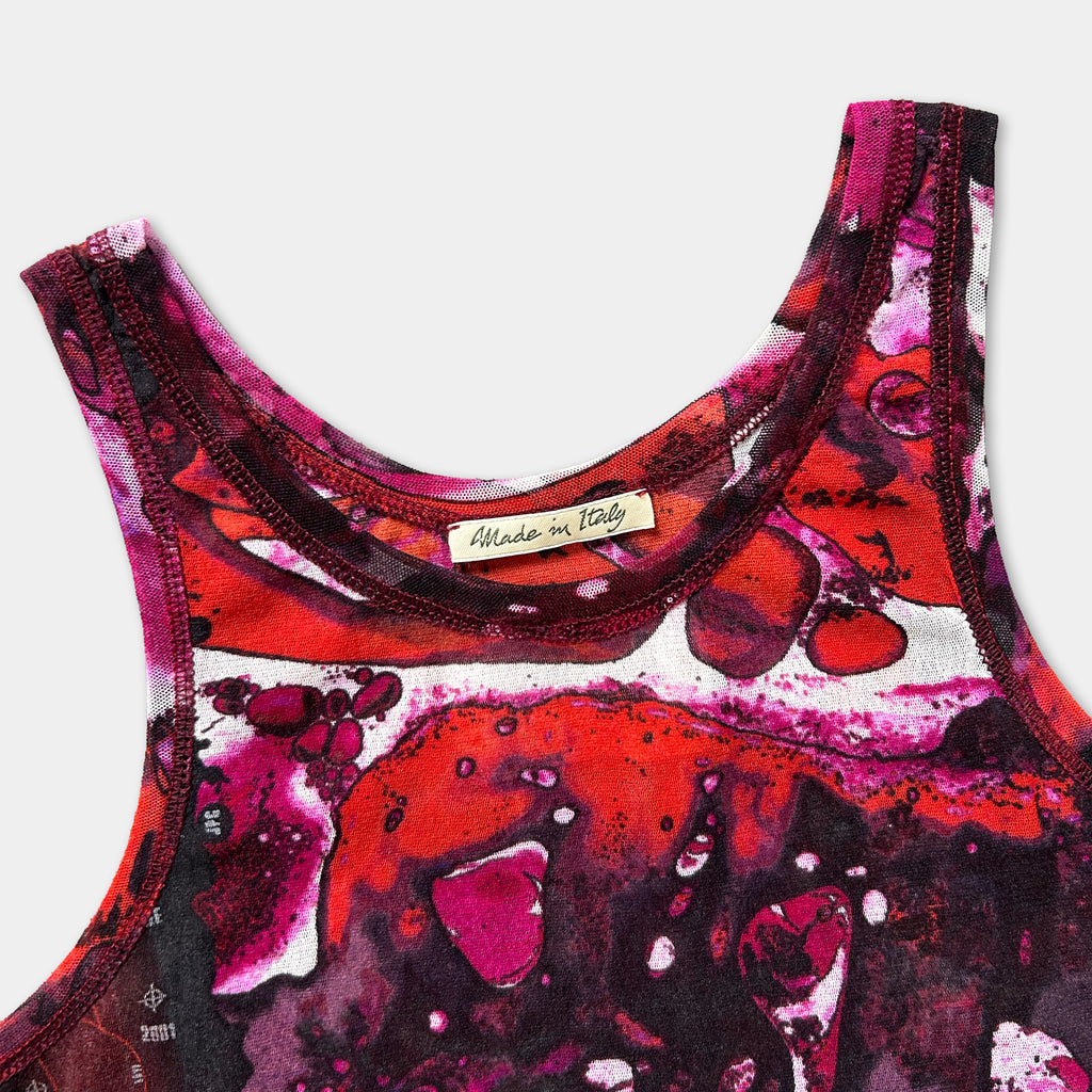 a close-up view of a colorful, abstract patterned tank top or sleeveless top with a label that reads "Made in Italy".