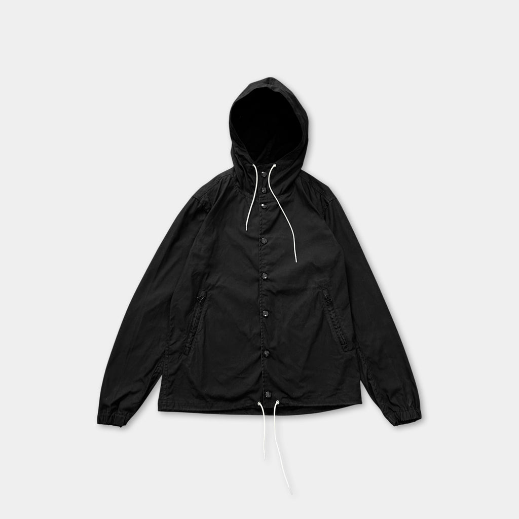 A black hooded jacket with white drawstrings and buttons.