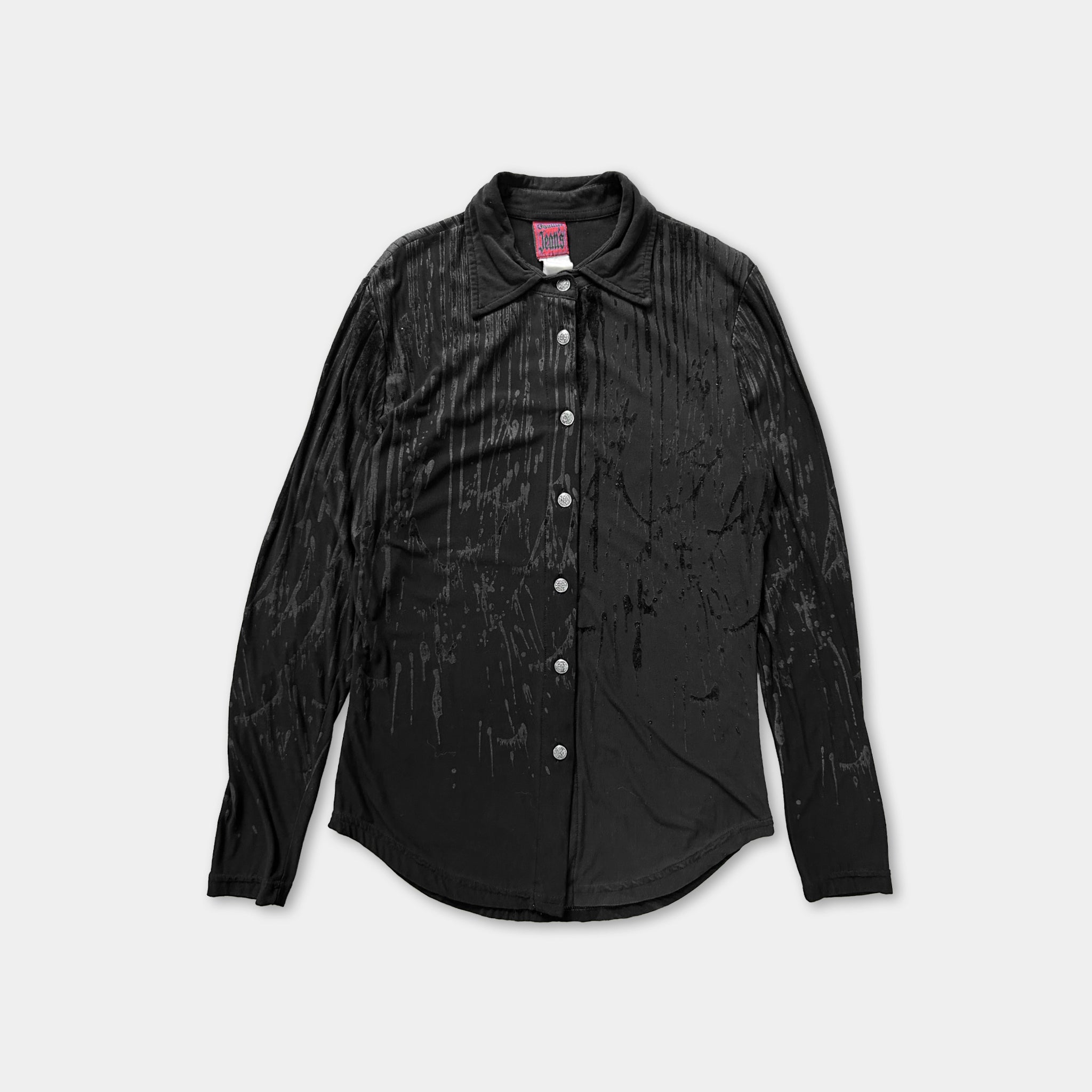 A black long-sleeved shirt with a collar and buttons, featuring a textured pattern.