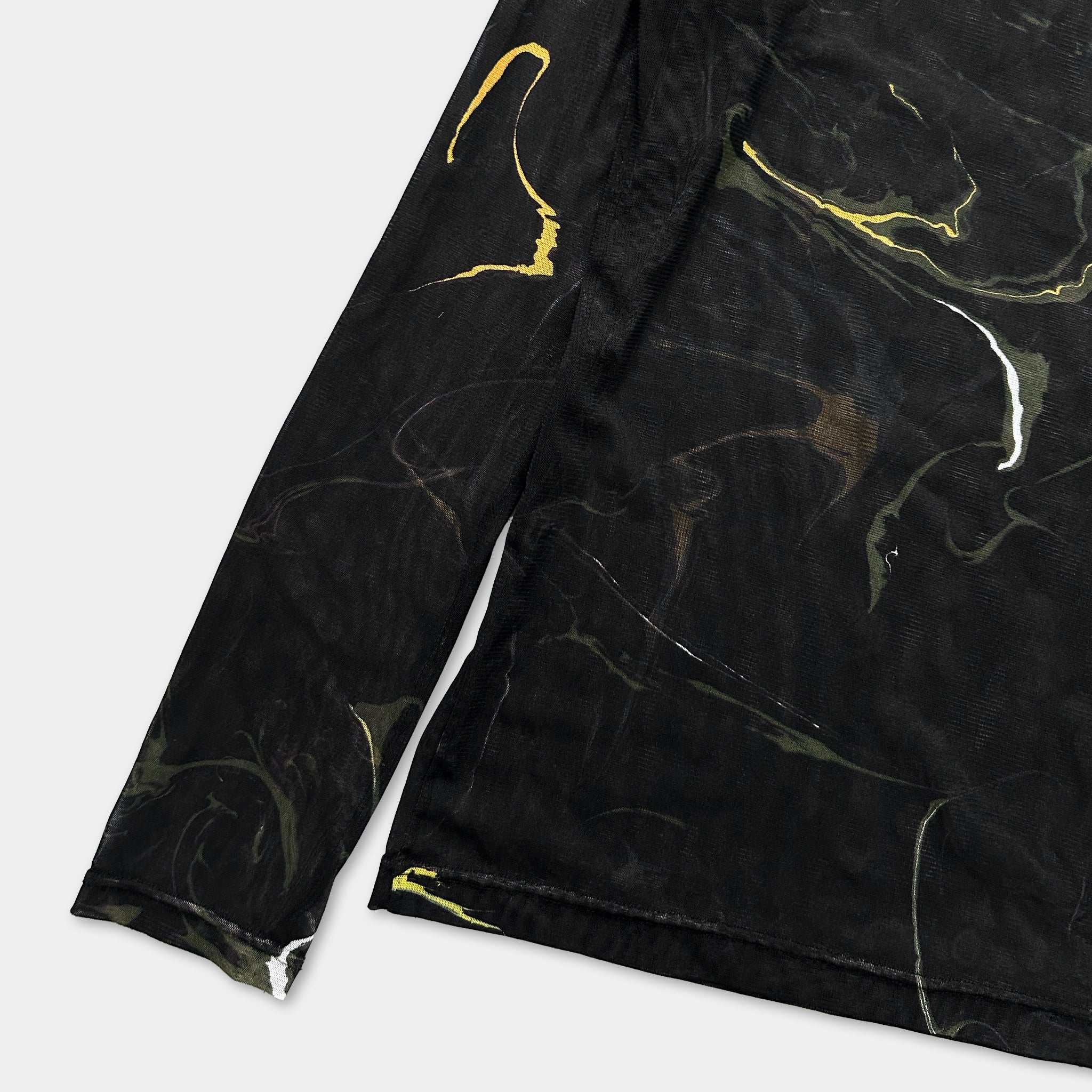 a black long-sleeved shirt with a marbled pattern on the front.