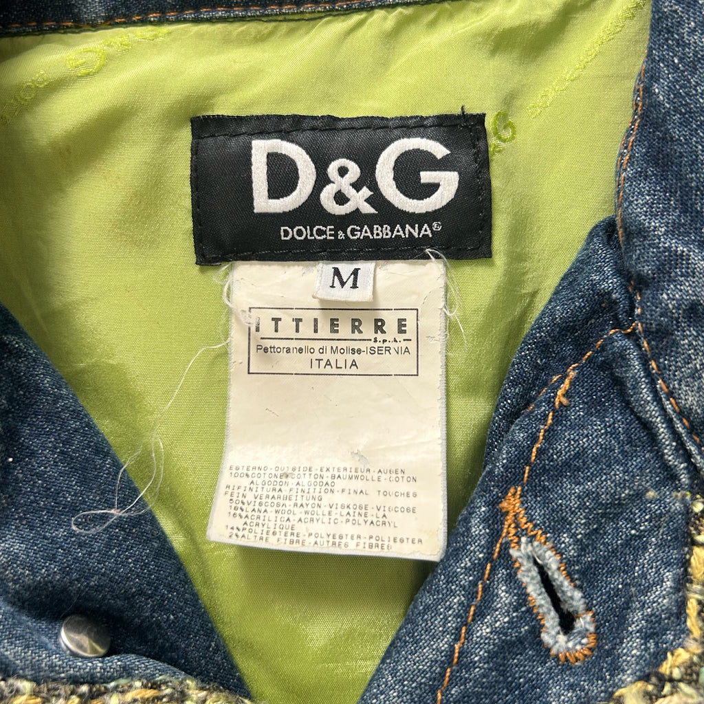 a close-up view of a D&G denim jacket, with a label attached to the inside of the jacket.