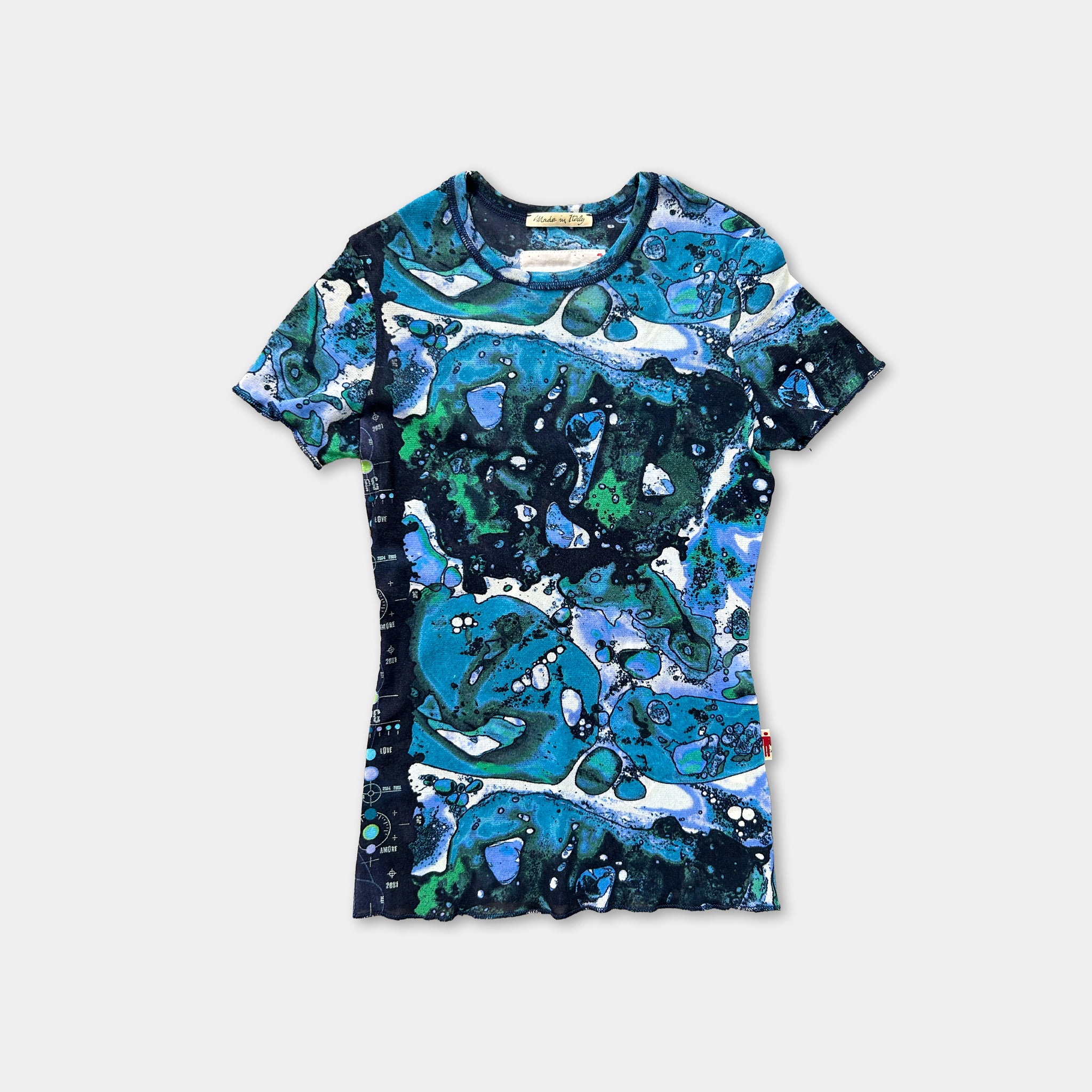 a colorful, abstract patterned shirt with a mix of blue, green, and white colors.