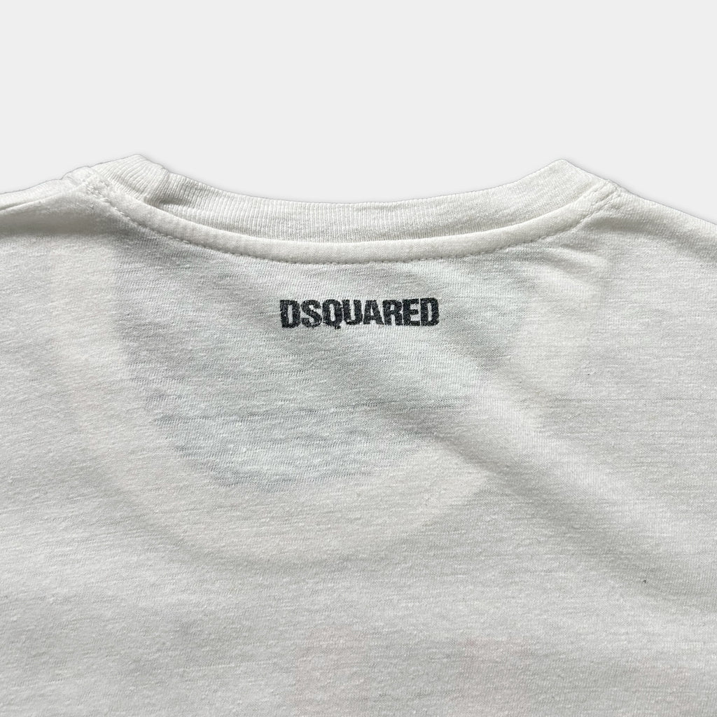 a close-up view of the back of a white t-shirt with the D squared logo printed on it.
