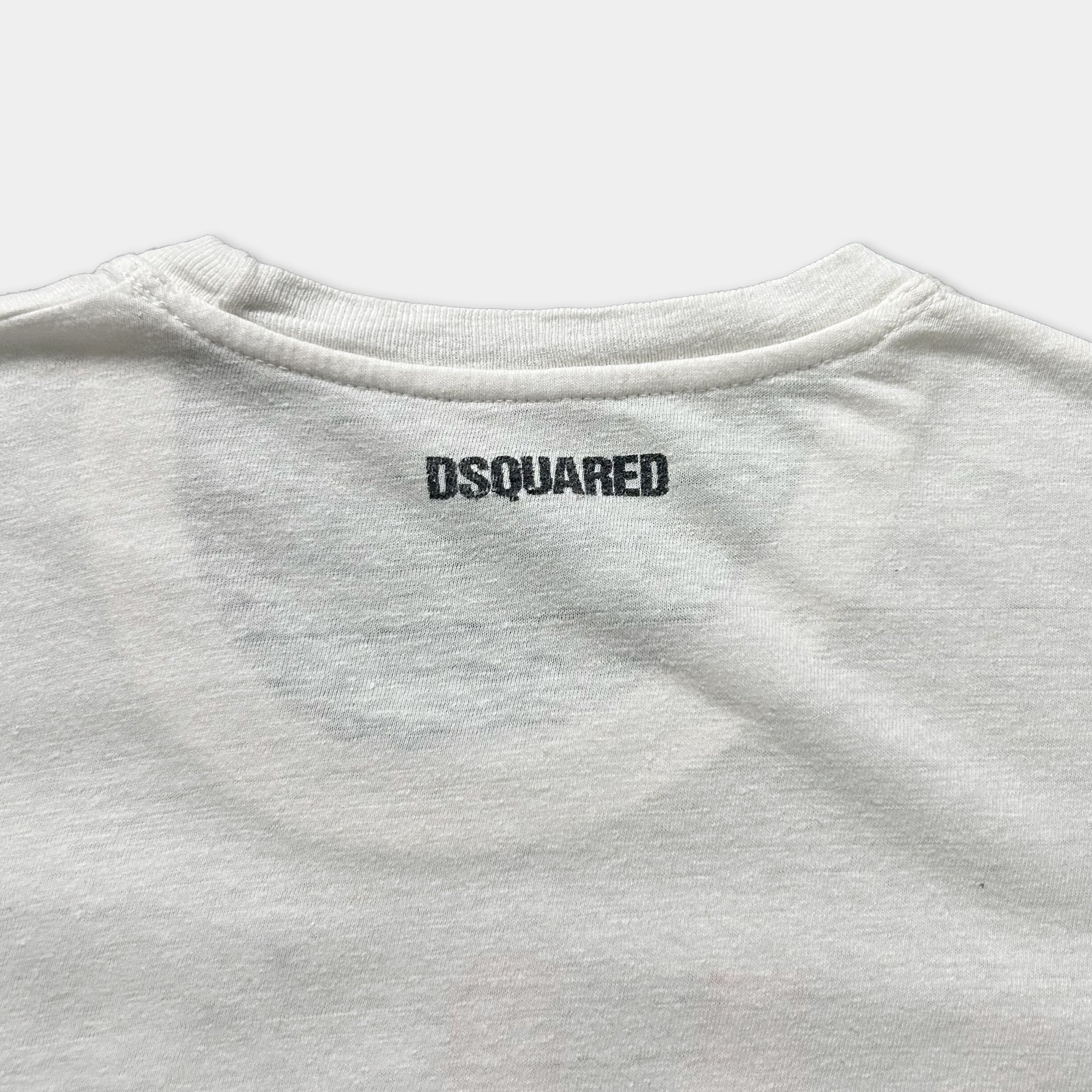 a close-up view of the back of a white t-shirt with the D squared logo printed on it.