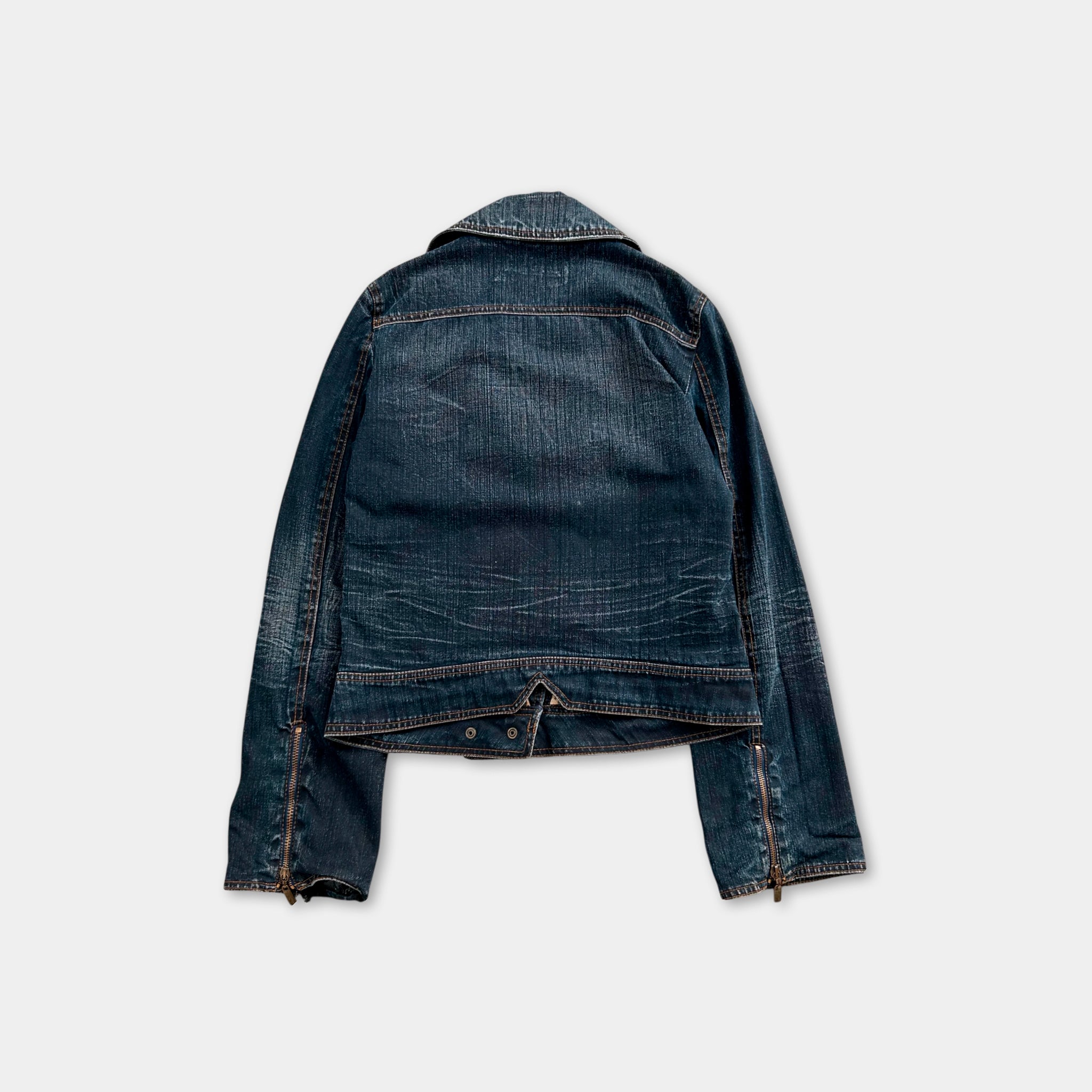 A dark blue denim jacket with a collar and zipper details is shown against a plain white background.